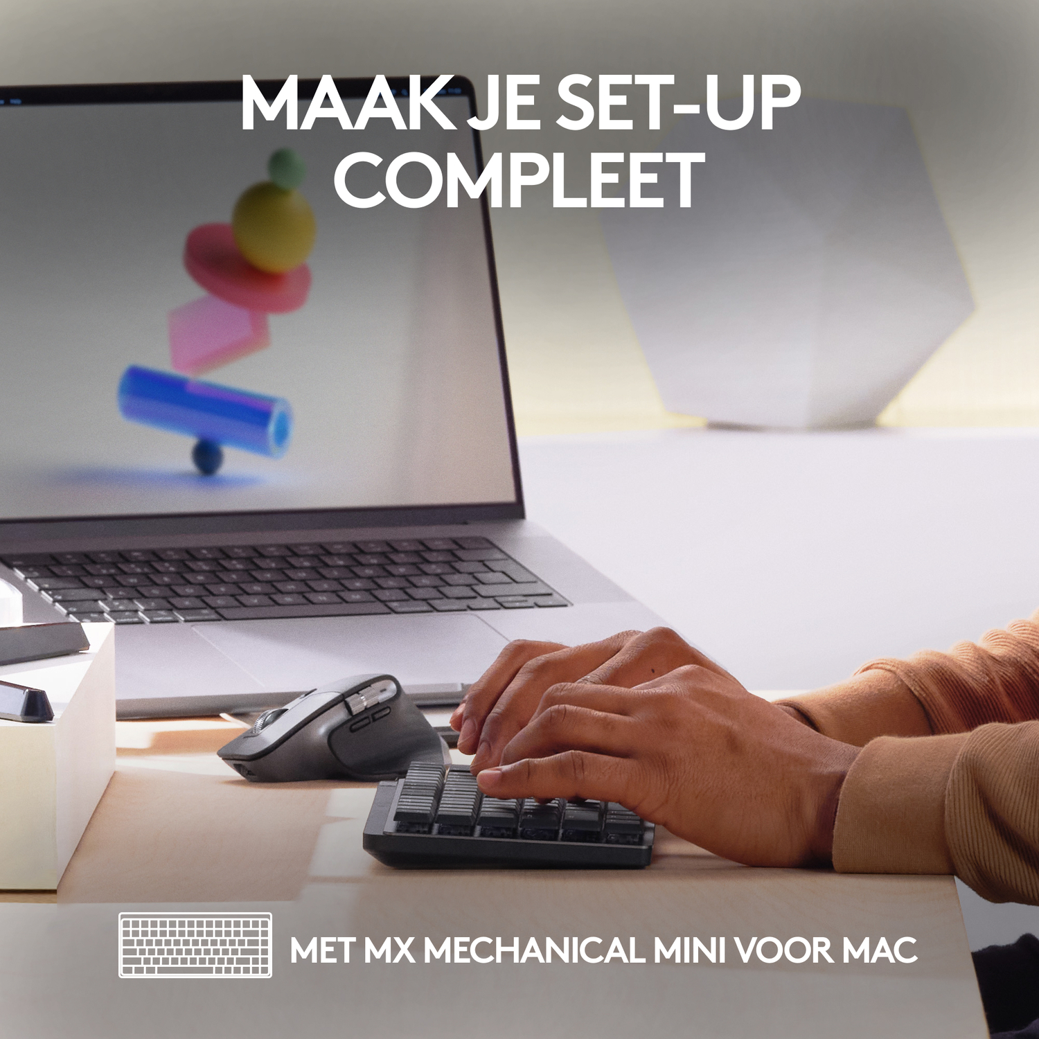 Hands typing on a keyboard, near a mouse and laptop.