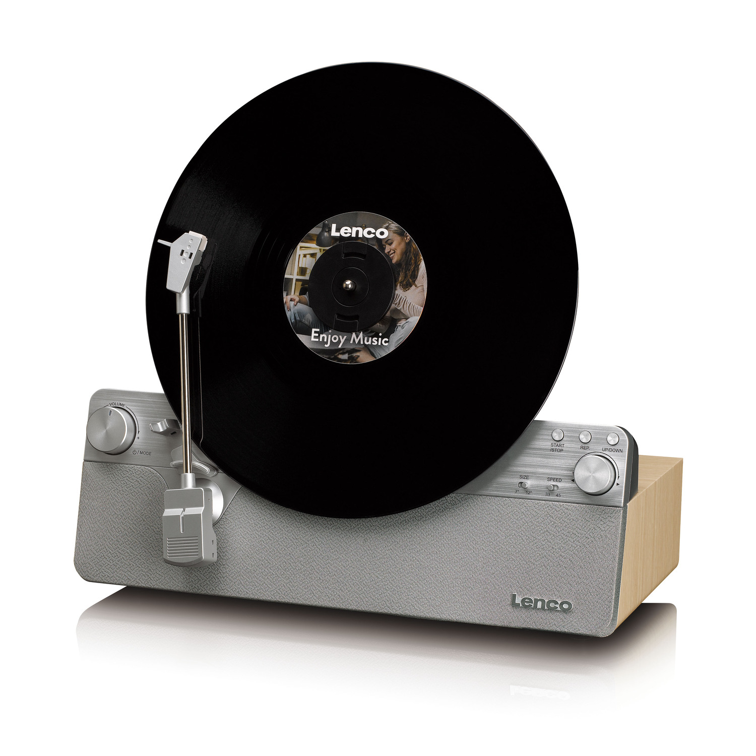 Black vinyl record playing on a vintage grey and wood record player.