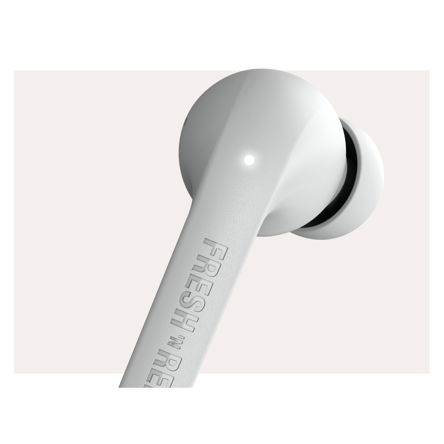 A white earbud with the word "FRESH 'N RE" printed on it.