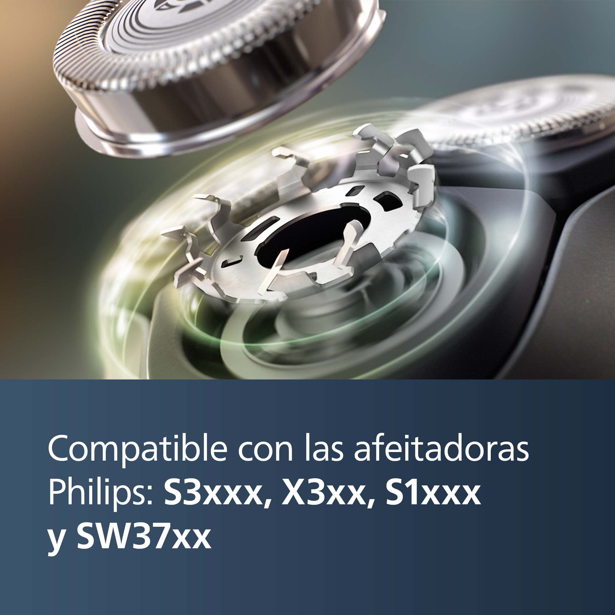 Primer plano de un cabezal de afeitadora con cuchillas visibles. Cabezal plateado en foco.