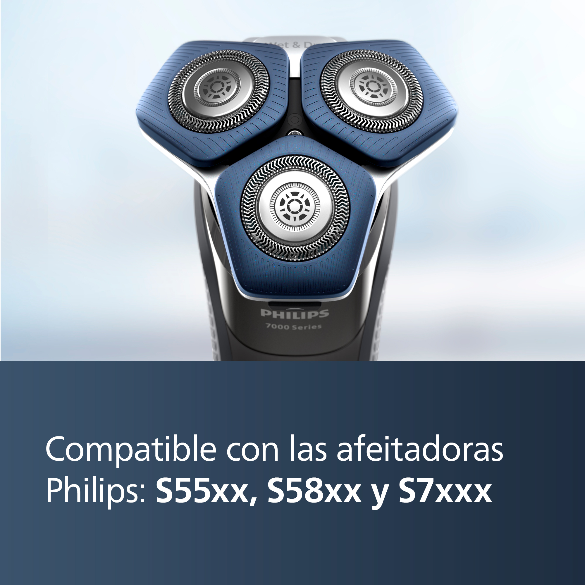 Primer plano de una afeitadora eléctrica Philips con tres cabezales de afeitado azules y plateados.