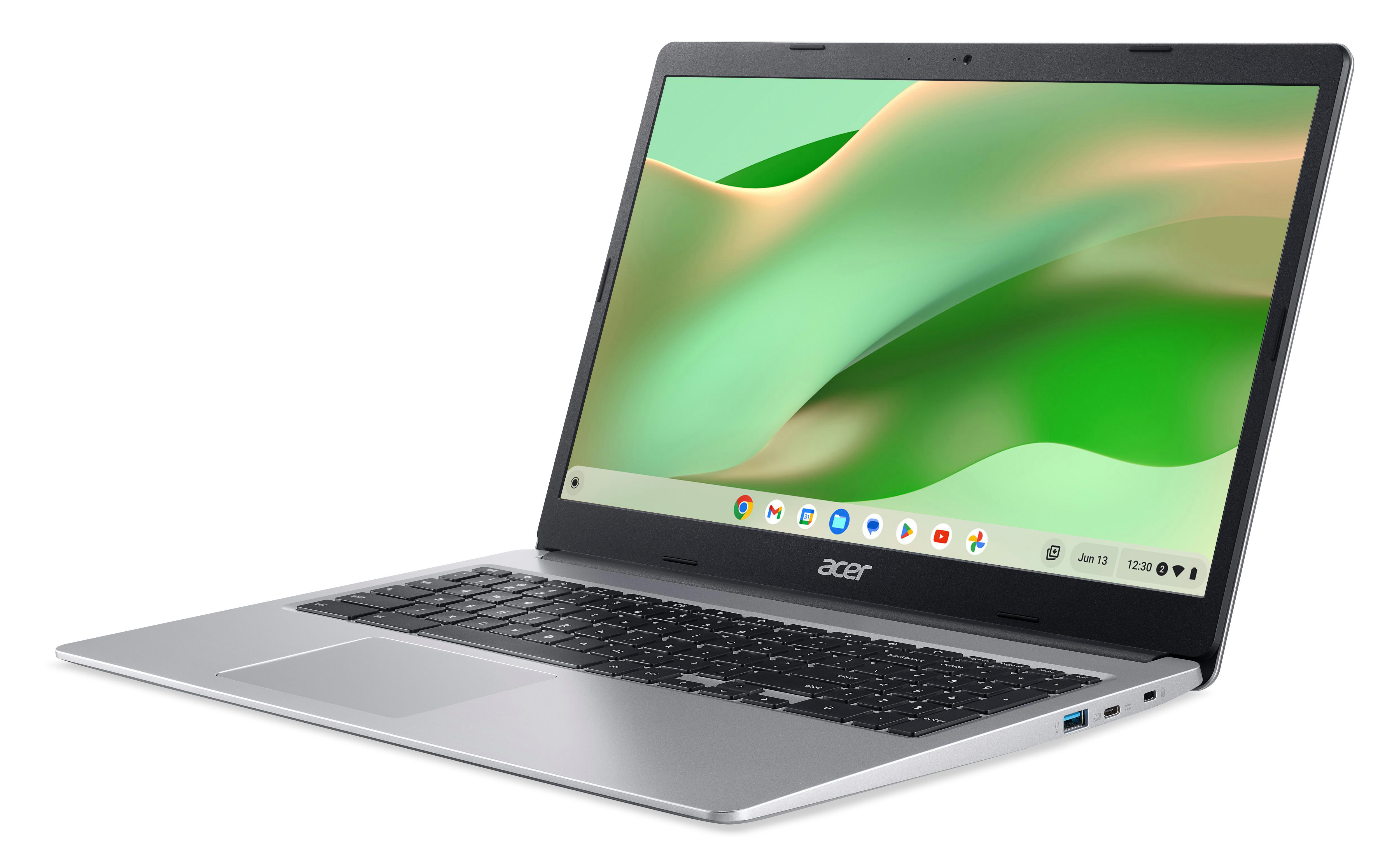 Ein silbernes Acer Chromebook Laptop geöffnet auf weißer Oberfläche, grüner und weißer Bildschirm.