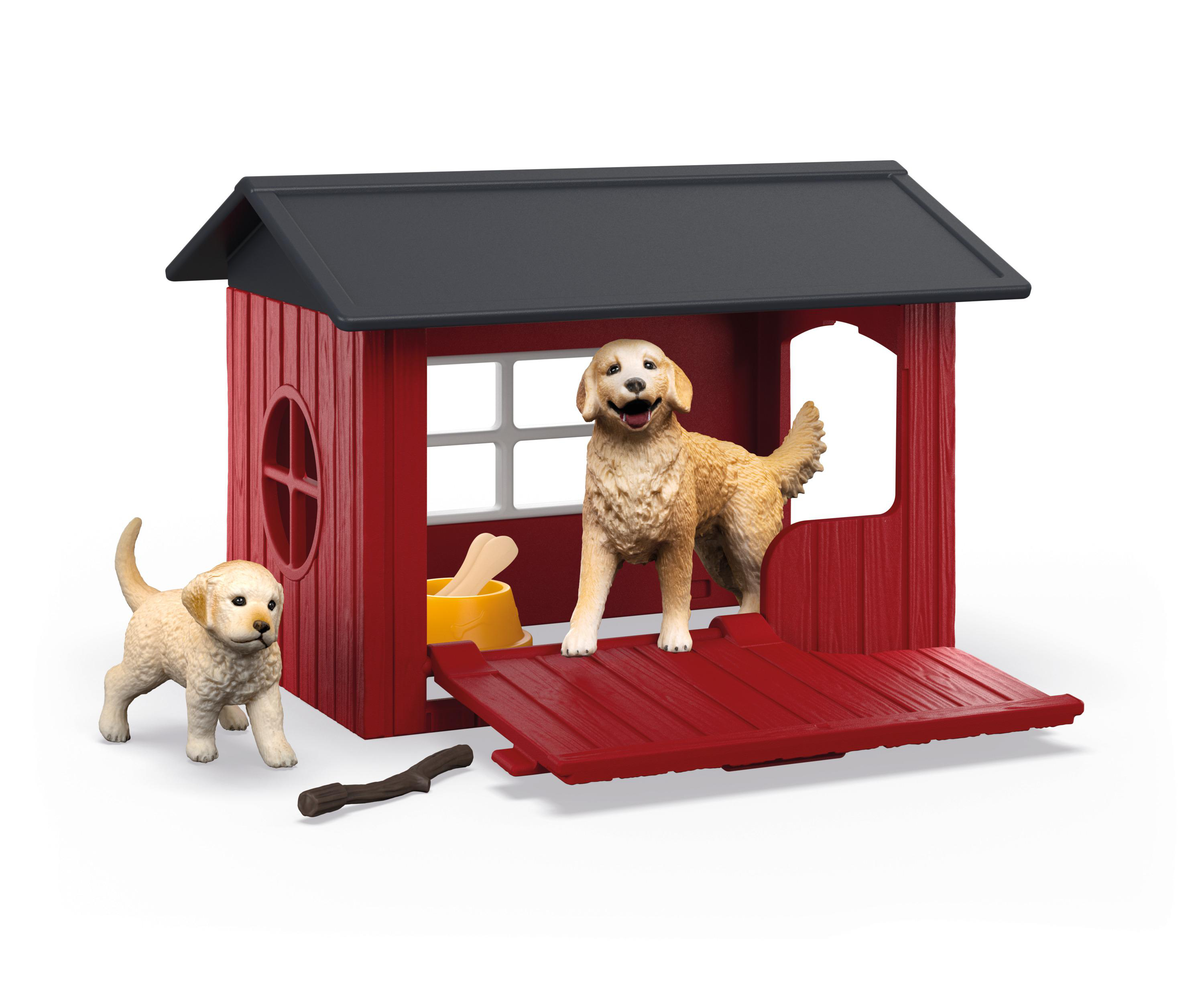 Zwei Spielzeughunde und ein rotes Hundehäuschen mit offener Tür und Futternapf.