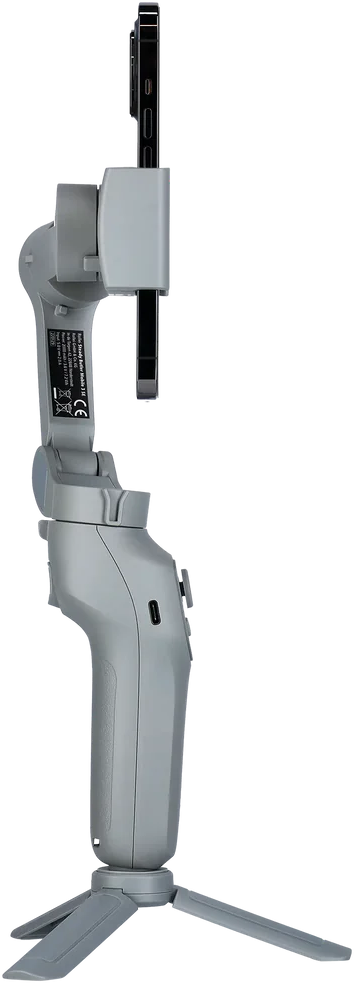 Ein grauer Telefonstabilisator mit angebrachtem Telefon auf einem Stativ vor schwarzem Hintergrund.