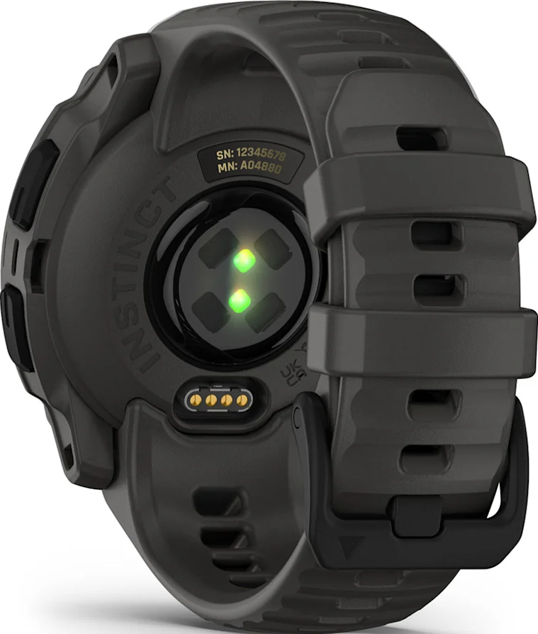 Vista inferiore dello smartwatch. Sensori e punti di ricarica sono visibili su cinturino grigio.