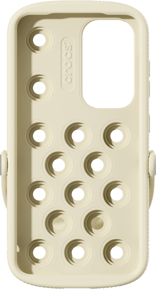 Custodia per telefono color crema con ritagli circolari. Il marchio Crocs è visibile. Sfondo nero.