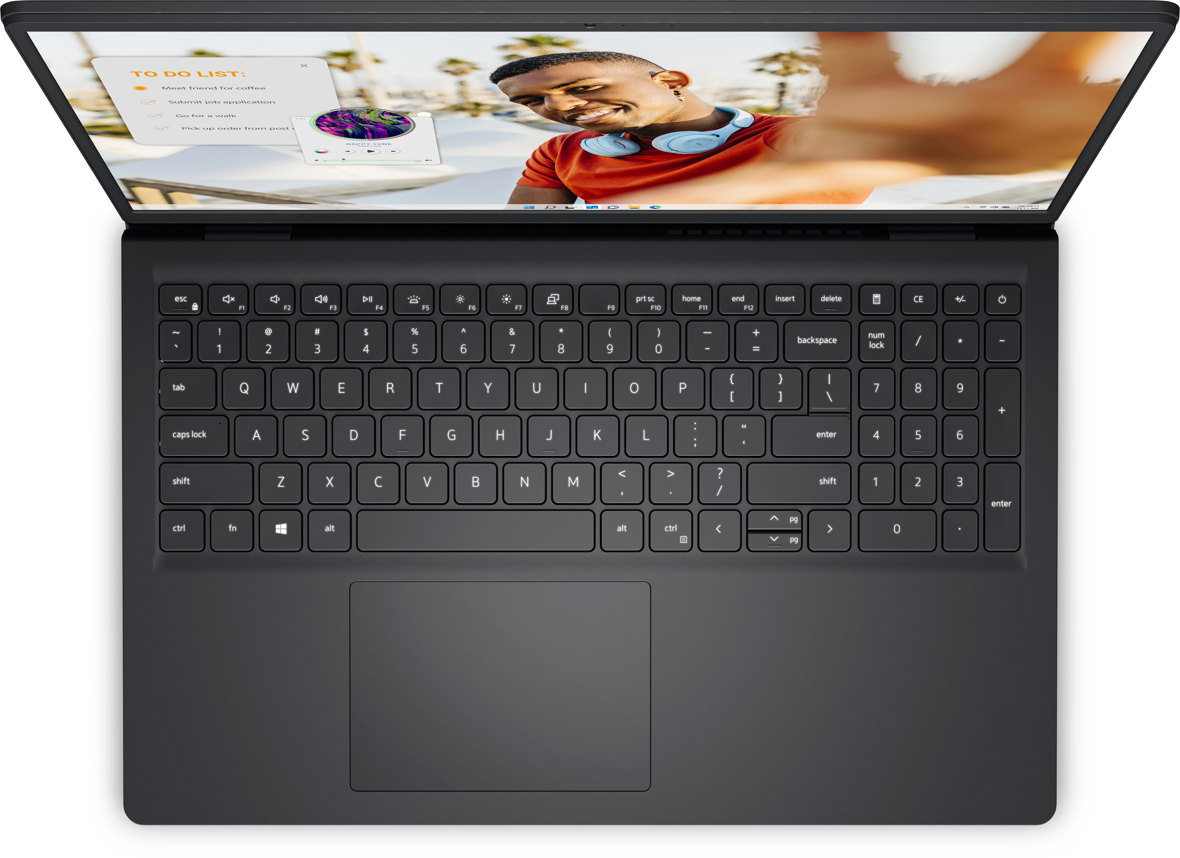 Draufsicht auf einen dunklen Laptop mit Tastatur und Bildschirm, der ein Video zeigt.