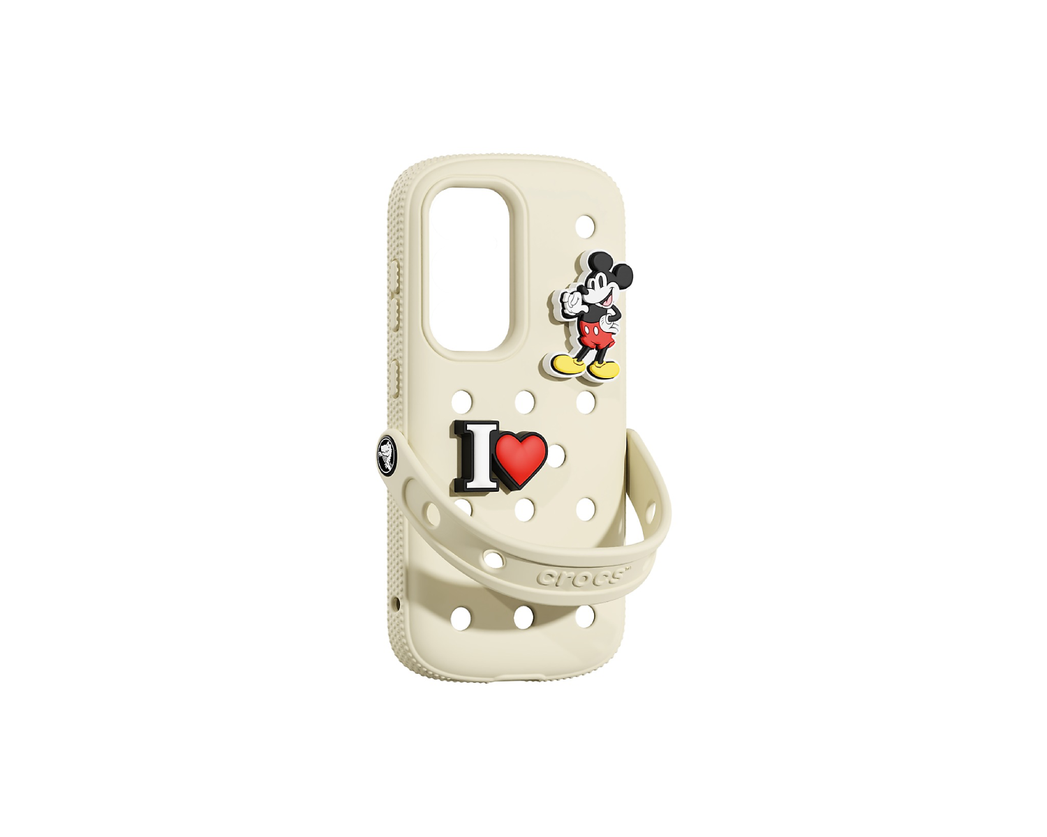 Una funda de teléfono color crema con Mickey Mouse y dijes de "I ❤️" y un logotipo de Crocs.