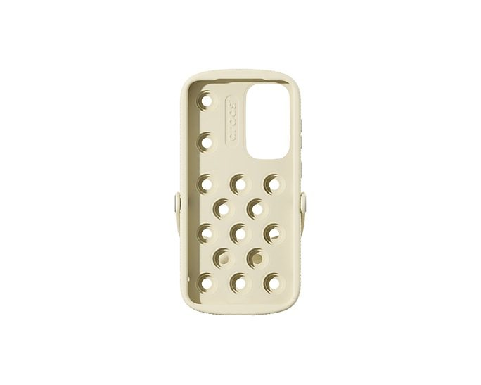 Funda de teléfono color crema con diseño Crocs, con agujeros y el logo Crocs.