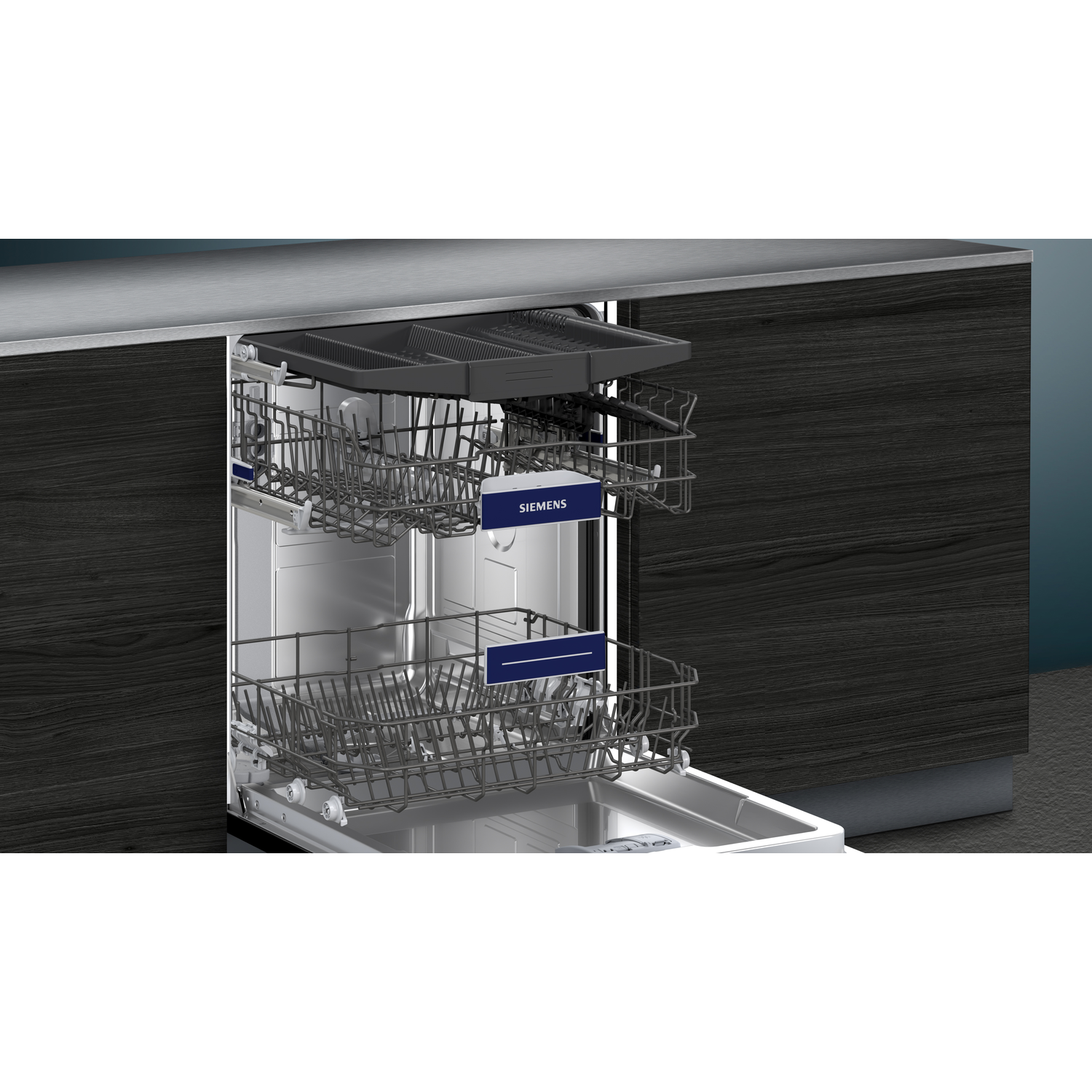 A dishwasher interior with racks, a tray, and the Siemens logo.