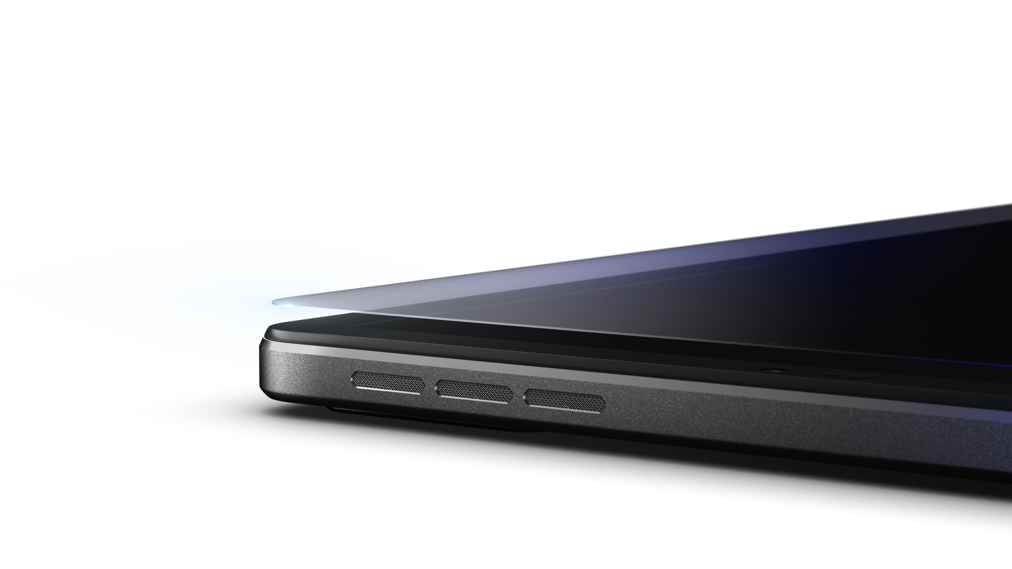 Close-up van een tablet rand met luidsprekers op een witte achtergrond.