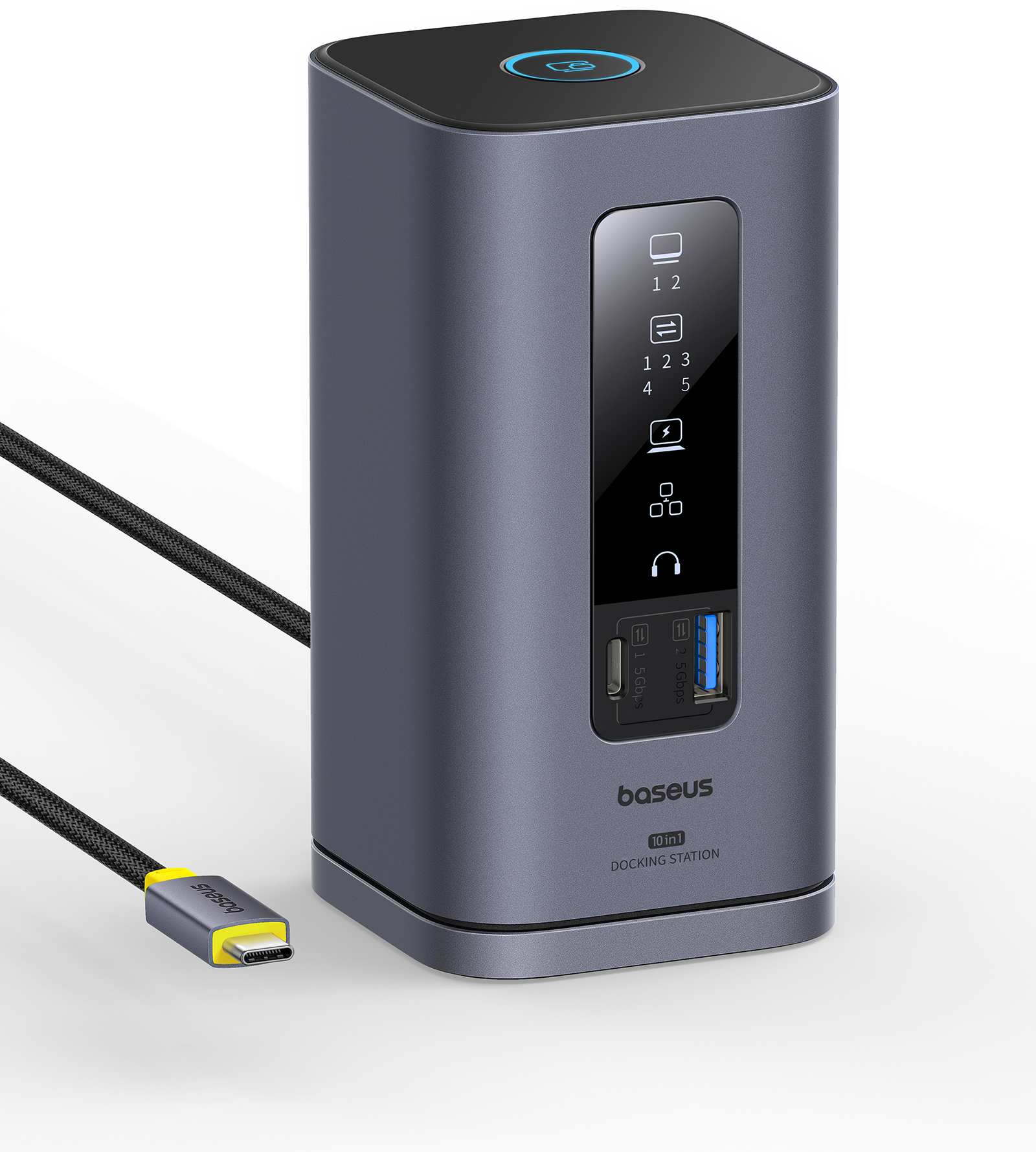 Sötétszürke dokkolóállomás, több porttal és egy sárga USB-C kábellel.