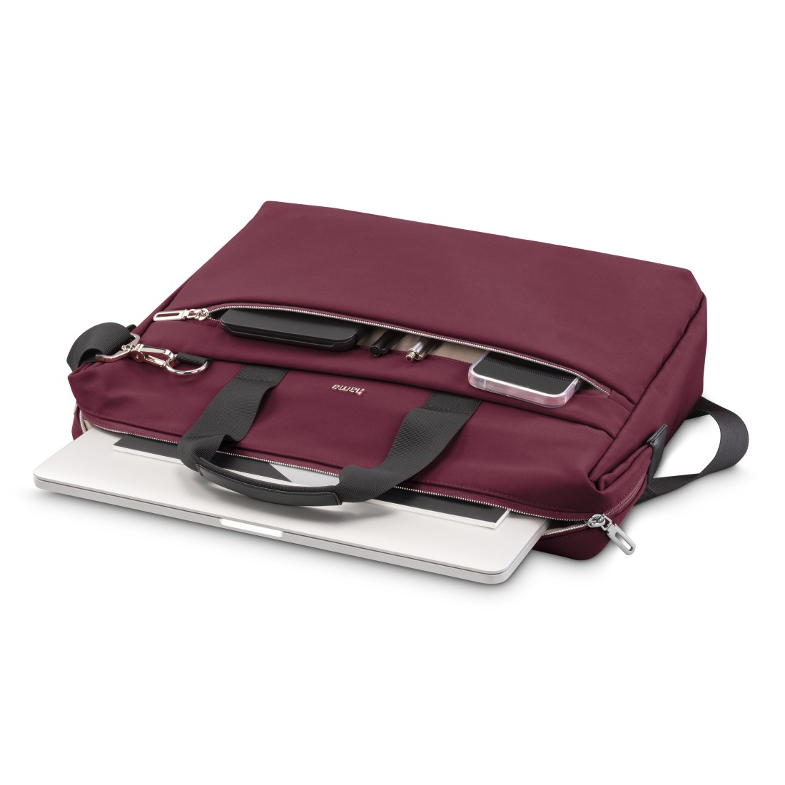 Burgunderfarbene Laptoptasche mit einem Laptop im Inneren, mit Zubehör.