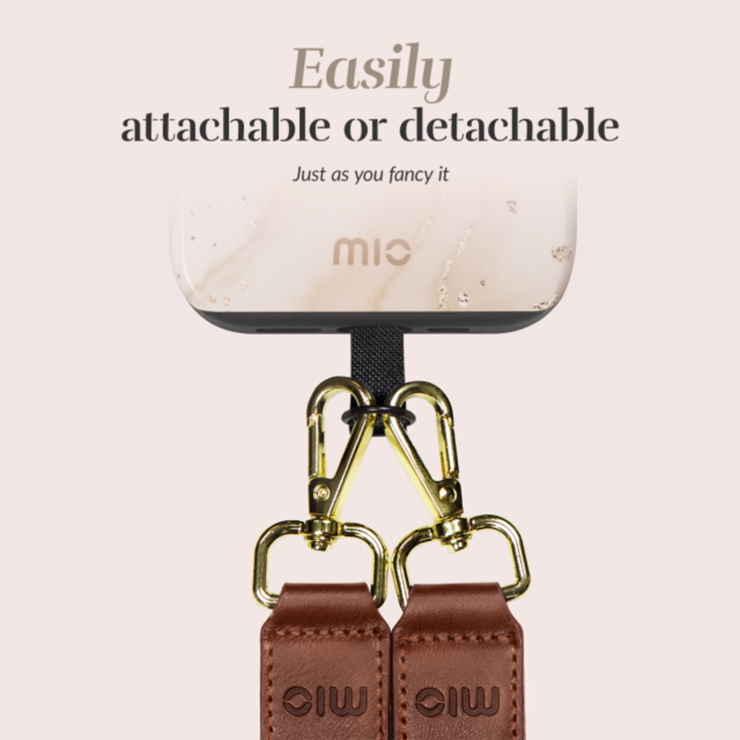 A phone case with a strap attachment. Leather strap with gold clasps, white phone back.