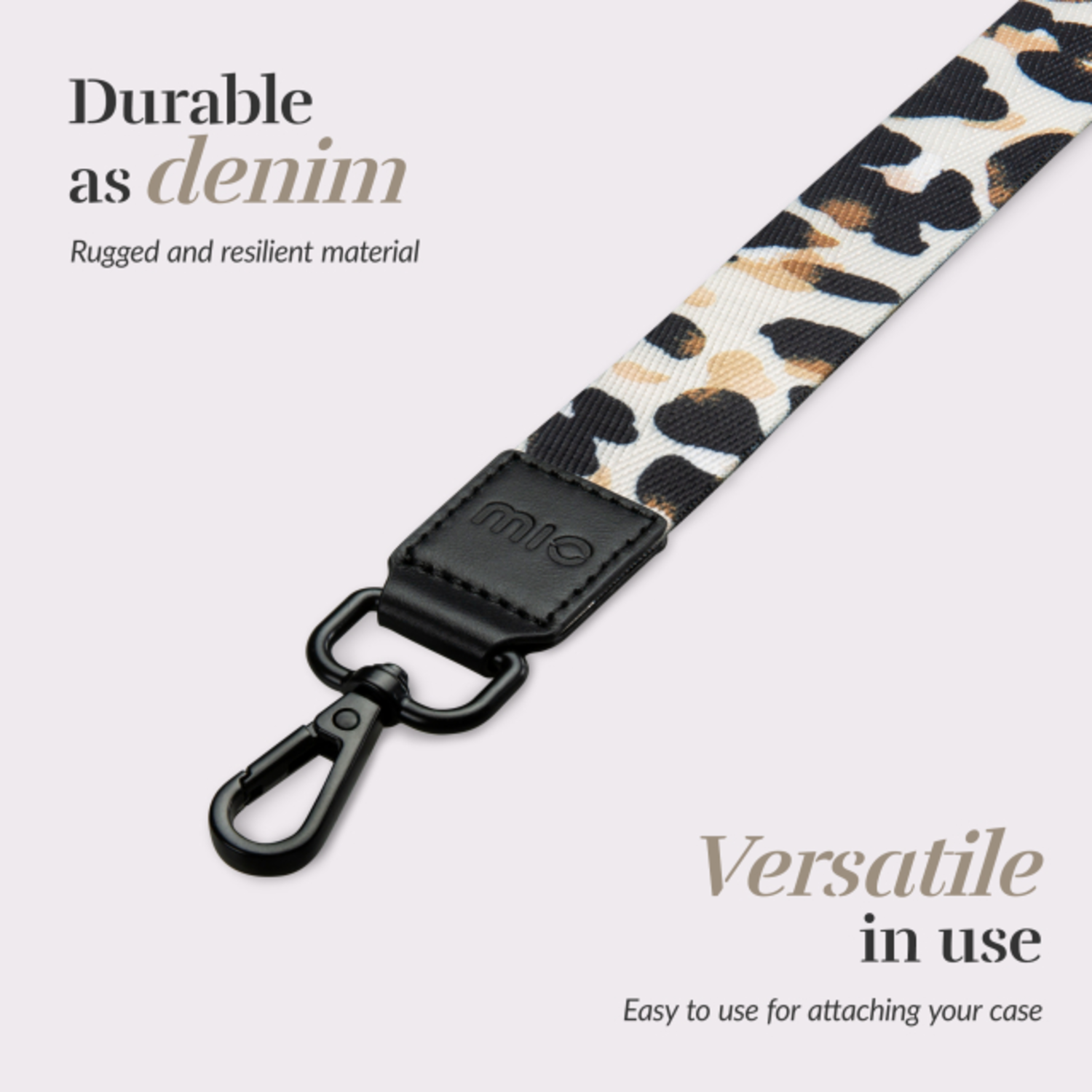 Lanyard with leopard print, a black clip, and the brand name.