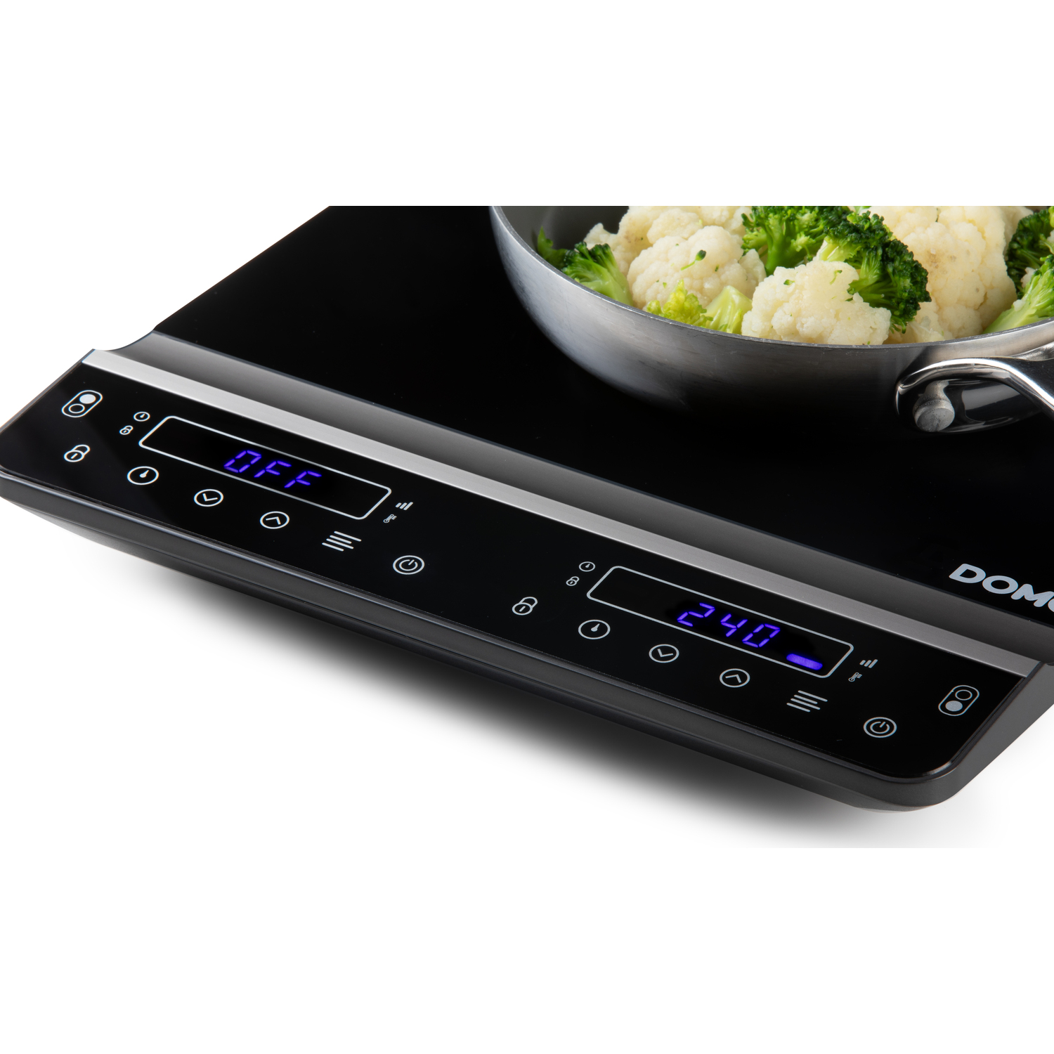 Induction stove top with pan and veggies.
