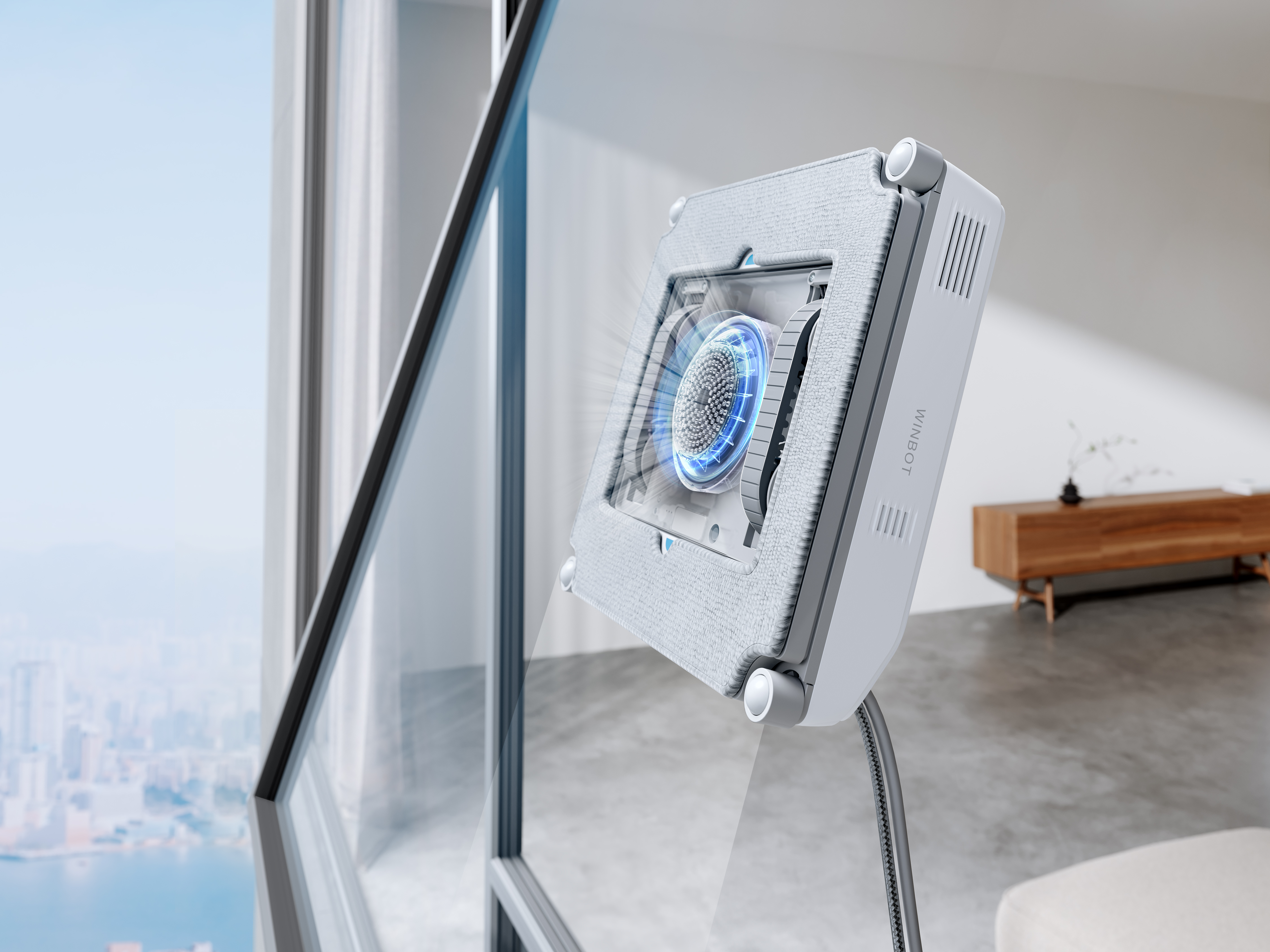 Ein Fensterputzroboter reinigt ein Fenster, im Hintergrund ist eine Stadtlandschaft zu sehen.