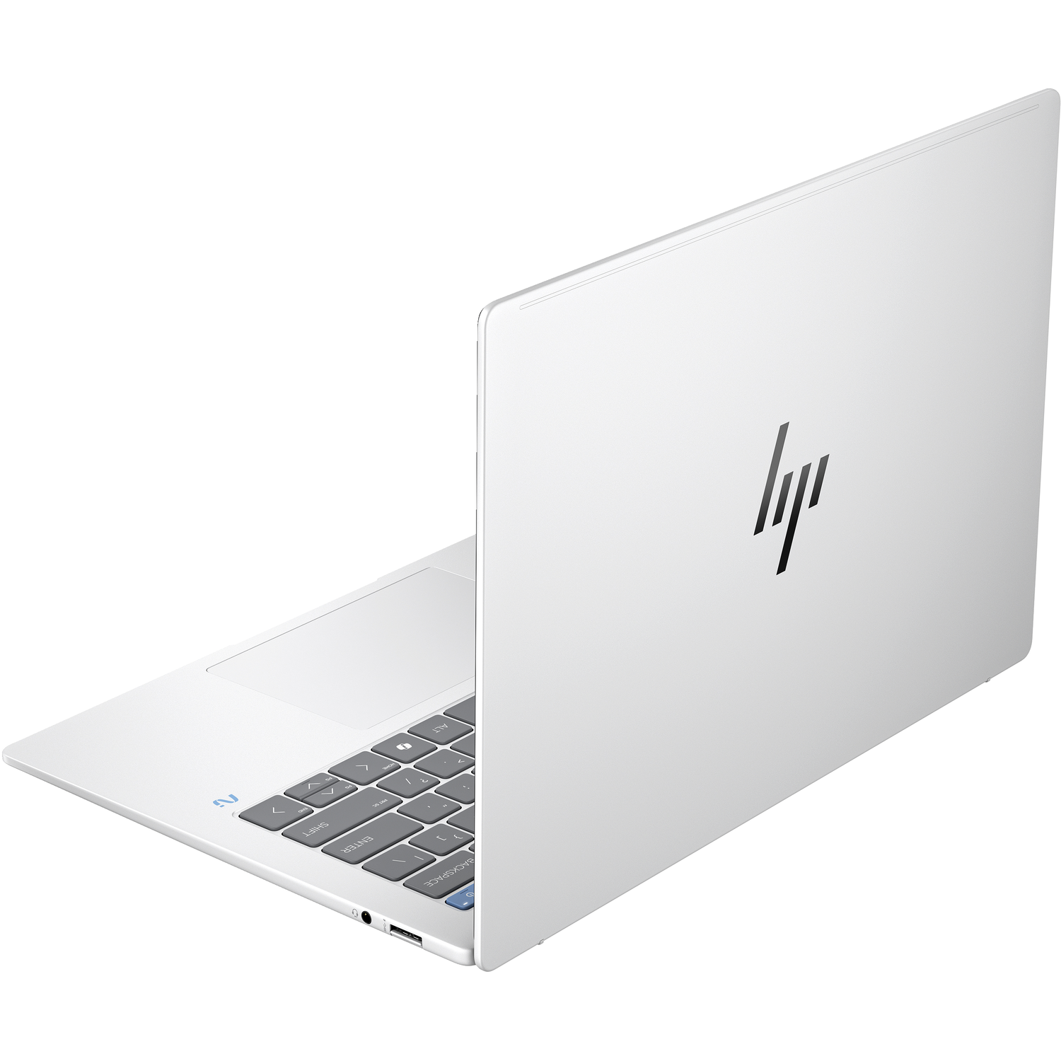A white laptop is slightly open, showing the keyboard. The HP logo is on the back.