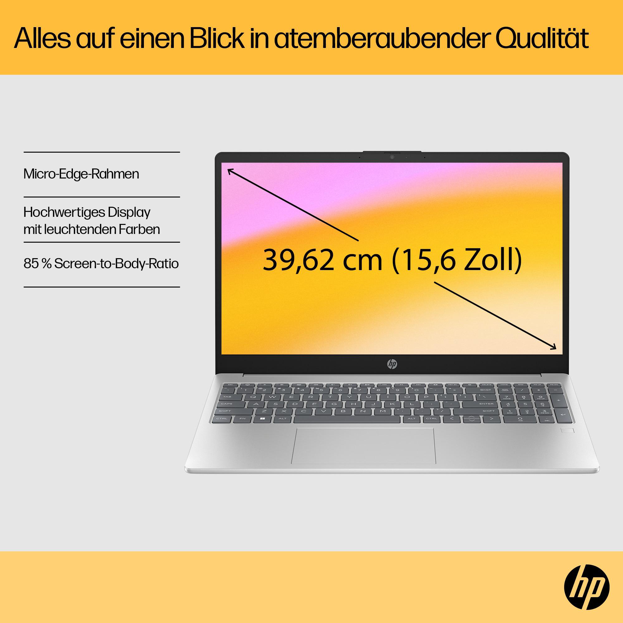 Silberner Laptop geöffnet, zeigt Bildschirm mit Text, Tastatur und Trackpad.