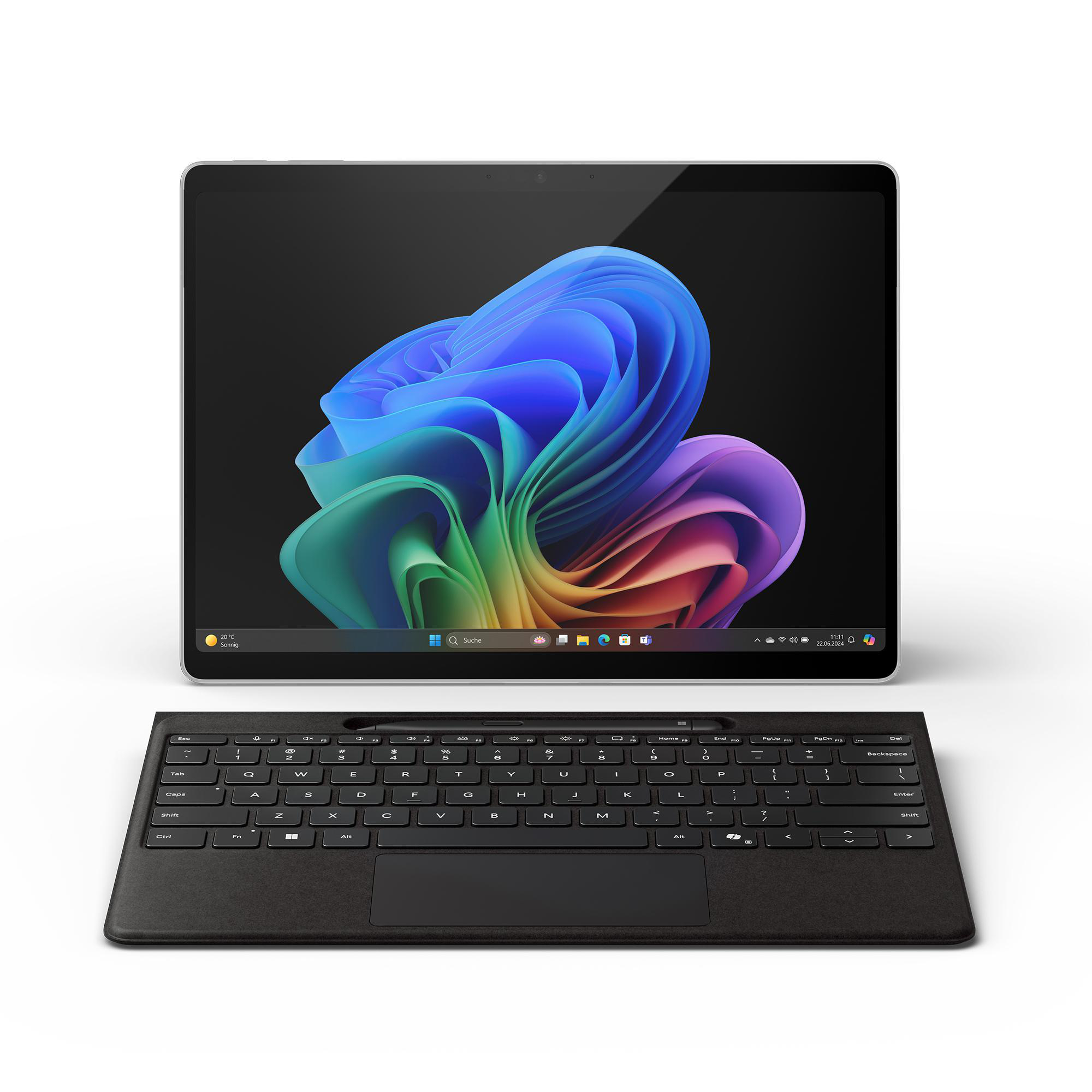 Ein Tablet mit angeschlossener Tastatur, der Bildschirm zeigt ein abstraktes Bild.