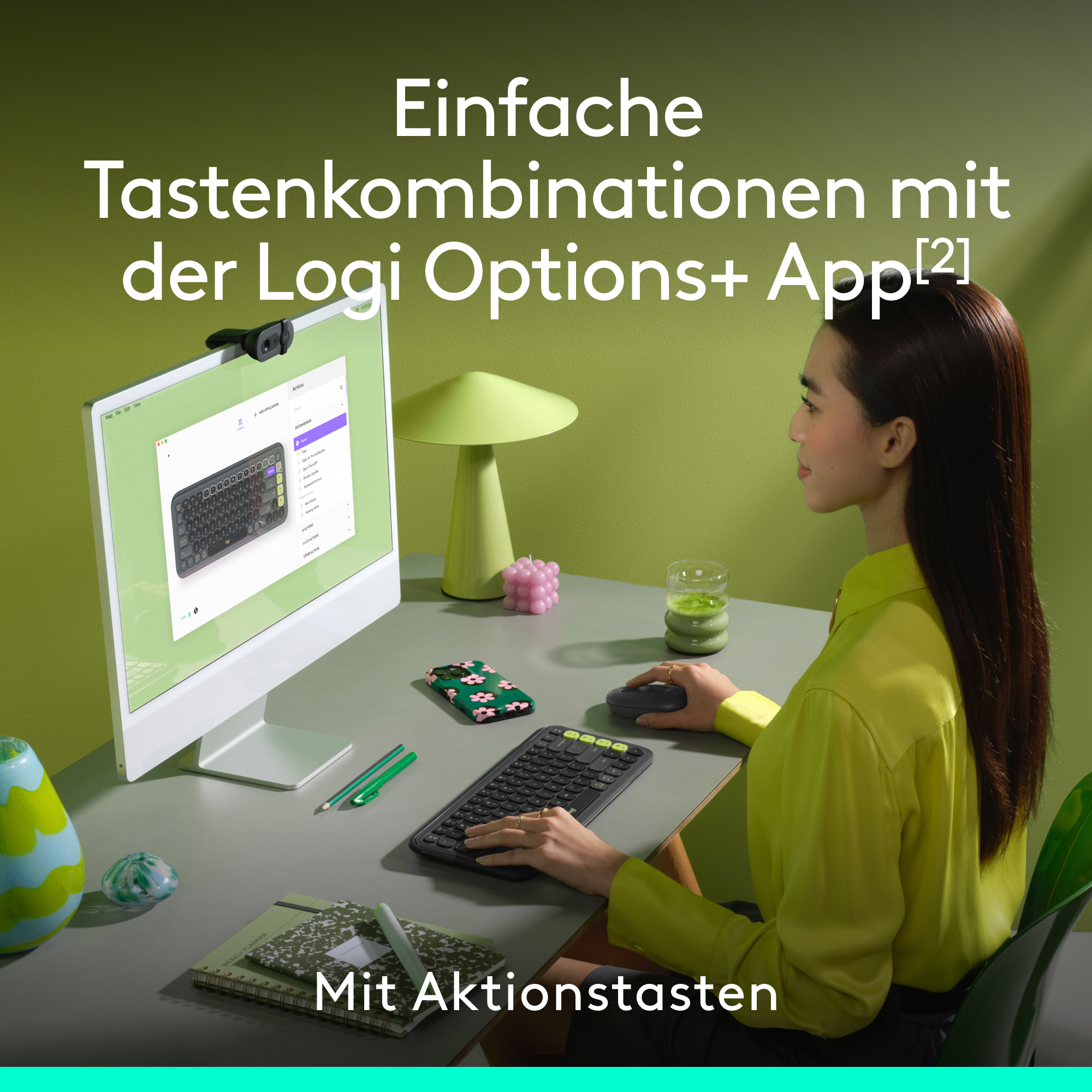 Schwarzer Laptop, geöffnet, zeigt eine Spielszene. Orangefarbener und pinkfarbener Hintergrund.