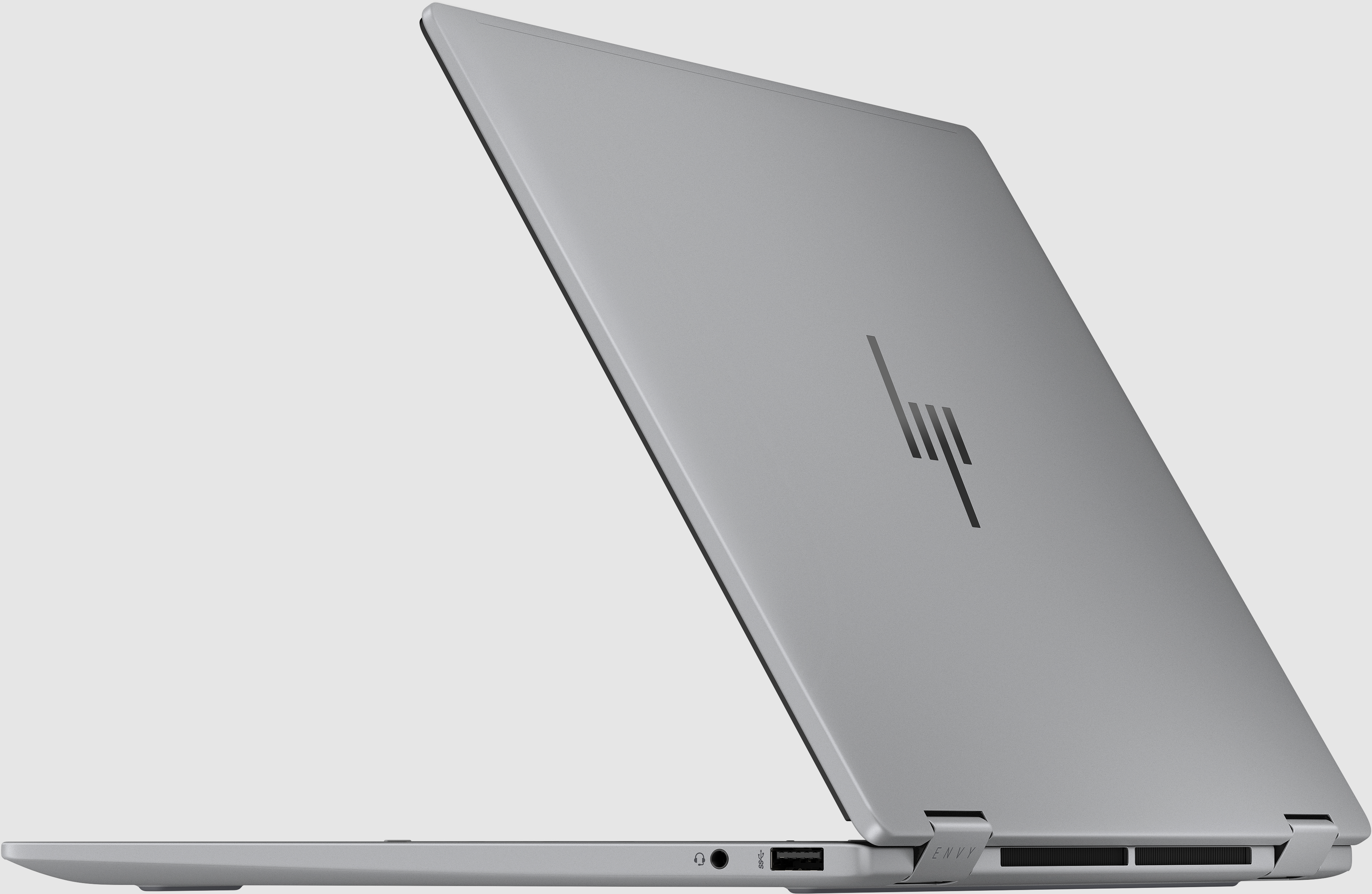 Ezüst HP laptop, csukva, látható HP logóval, világos háttérrel.