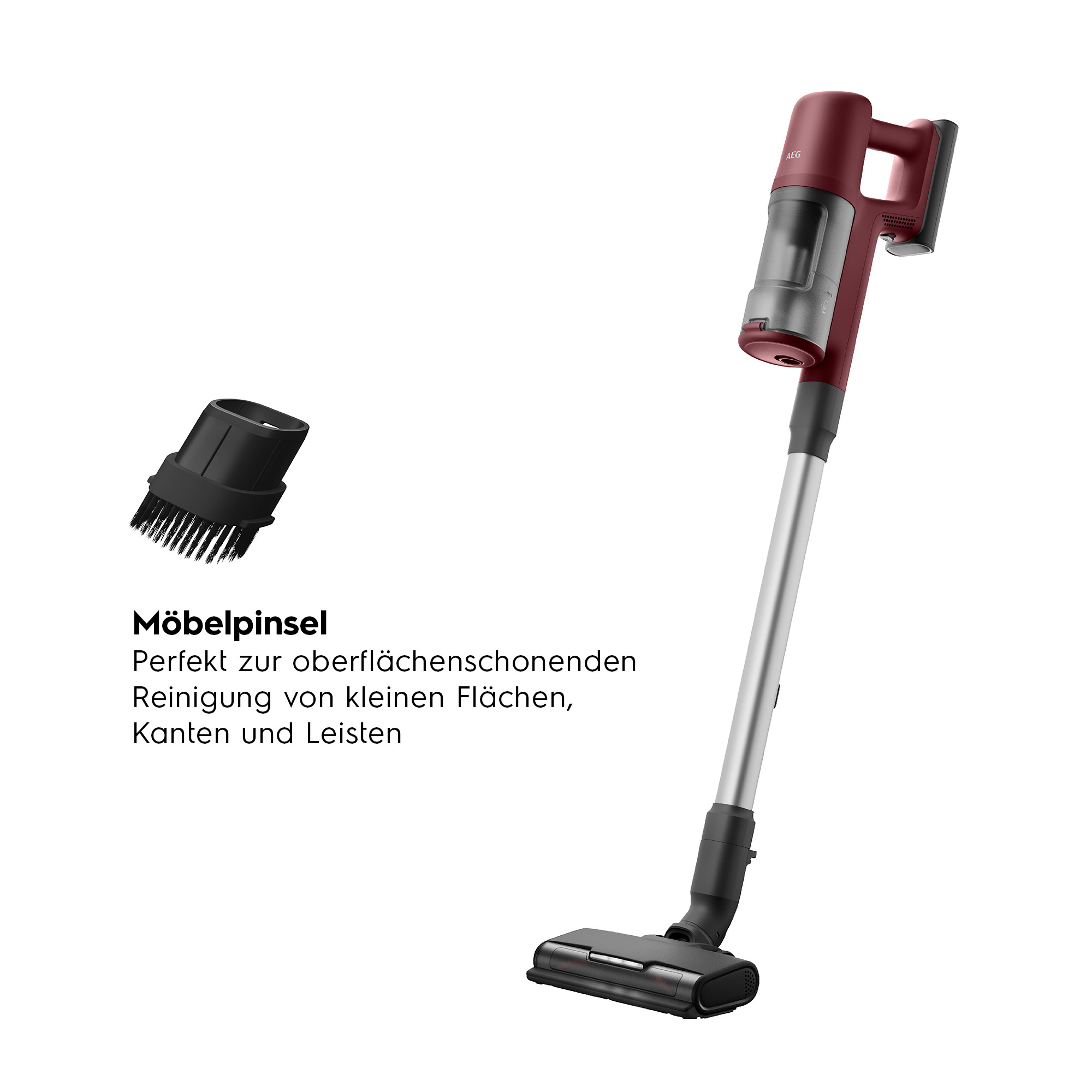 Ein roter und schwarzer Staubsauger mit einer zusätzlichen Bürste auf weißem Hintergrund.