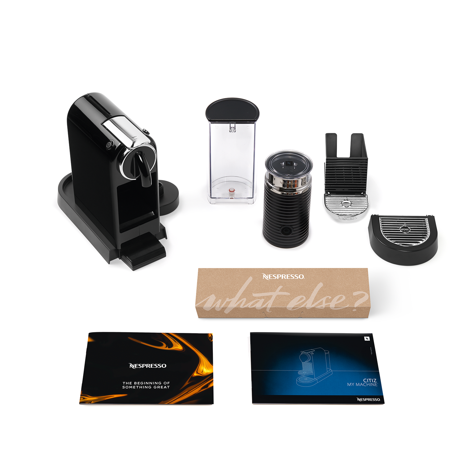 A black Nespresso machine and its components are arranged on a white surface.