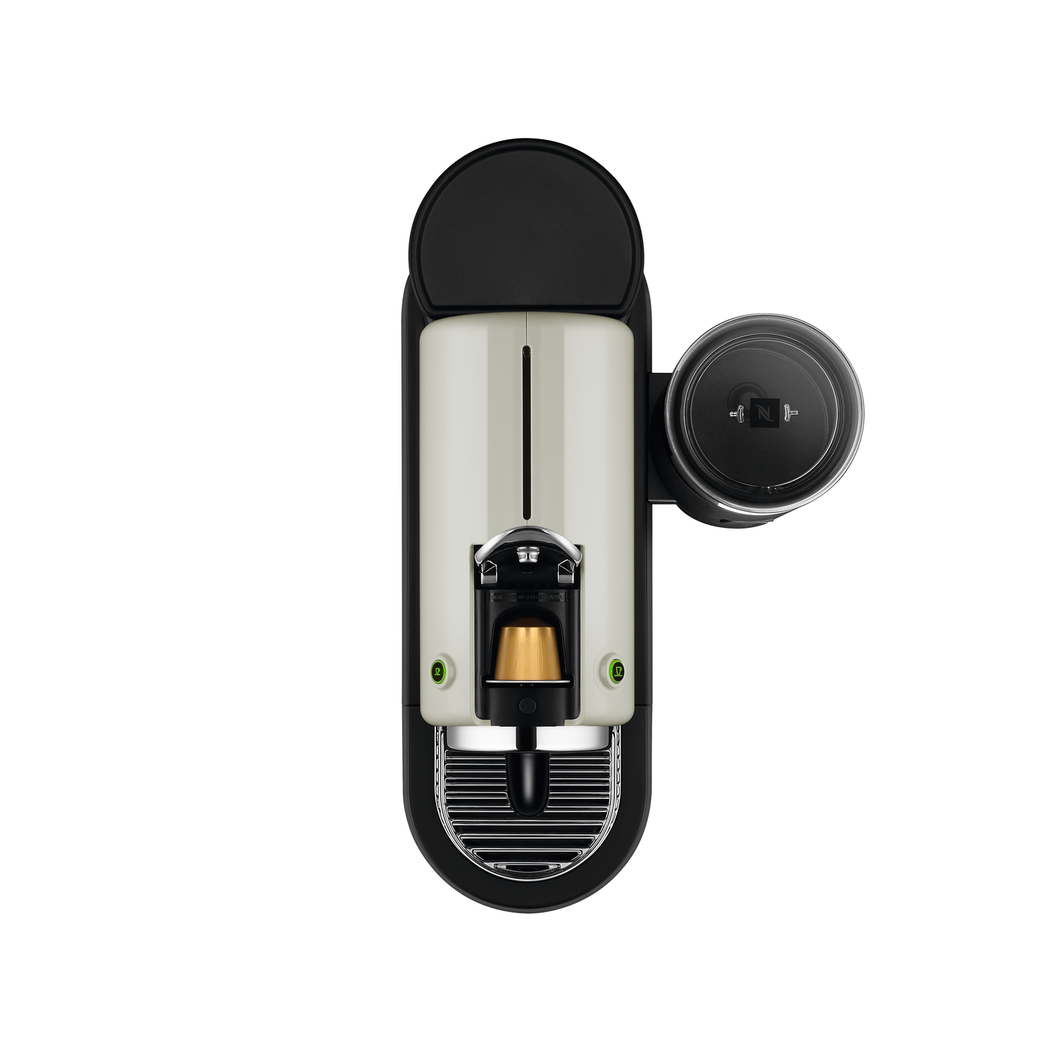 Top-down view of a Nespresso coffee machine, black and cream color, with a capsule.