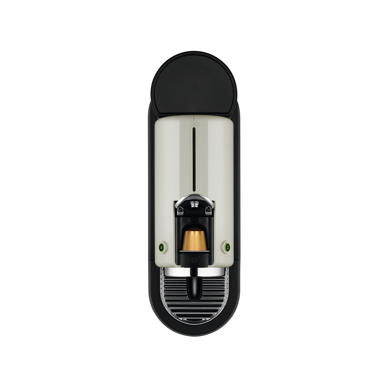 Top-down view of a Nespresso coffee machine, black and cream color, with a capsule.