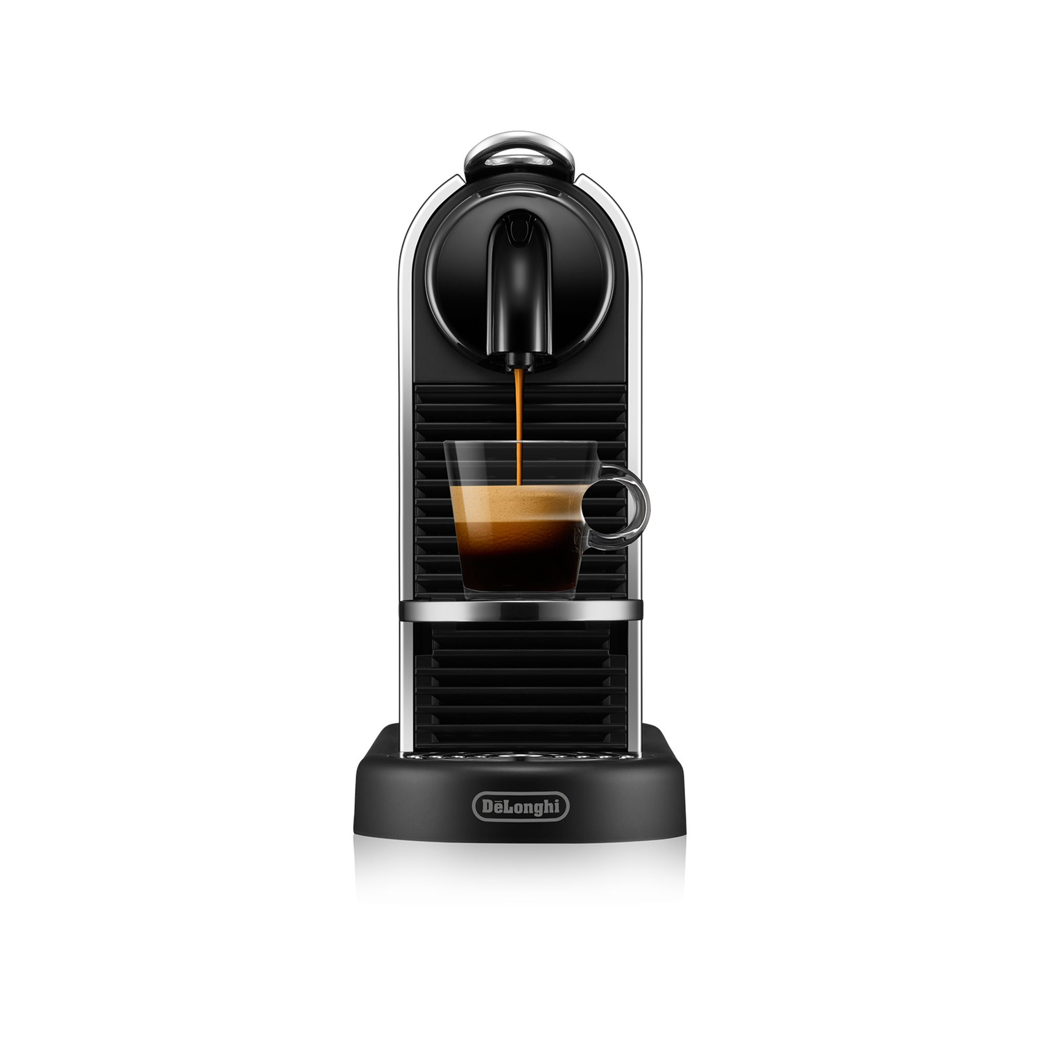 Espresso machine with coffee pouring into a glass. Black and silver, Delonghi brand.
