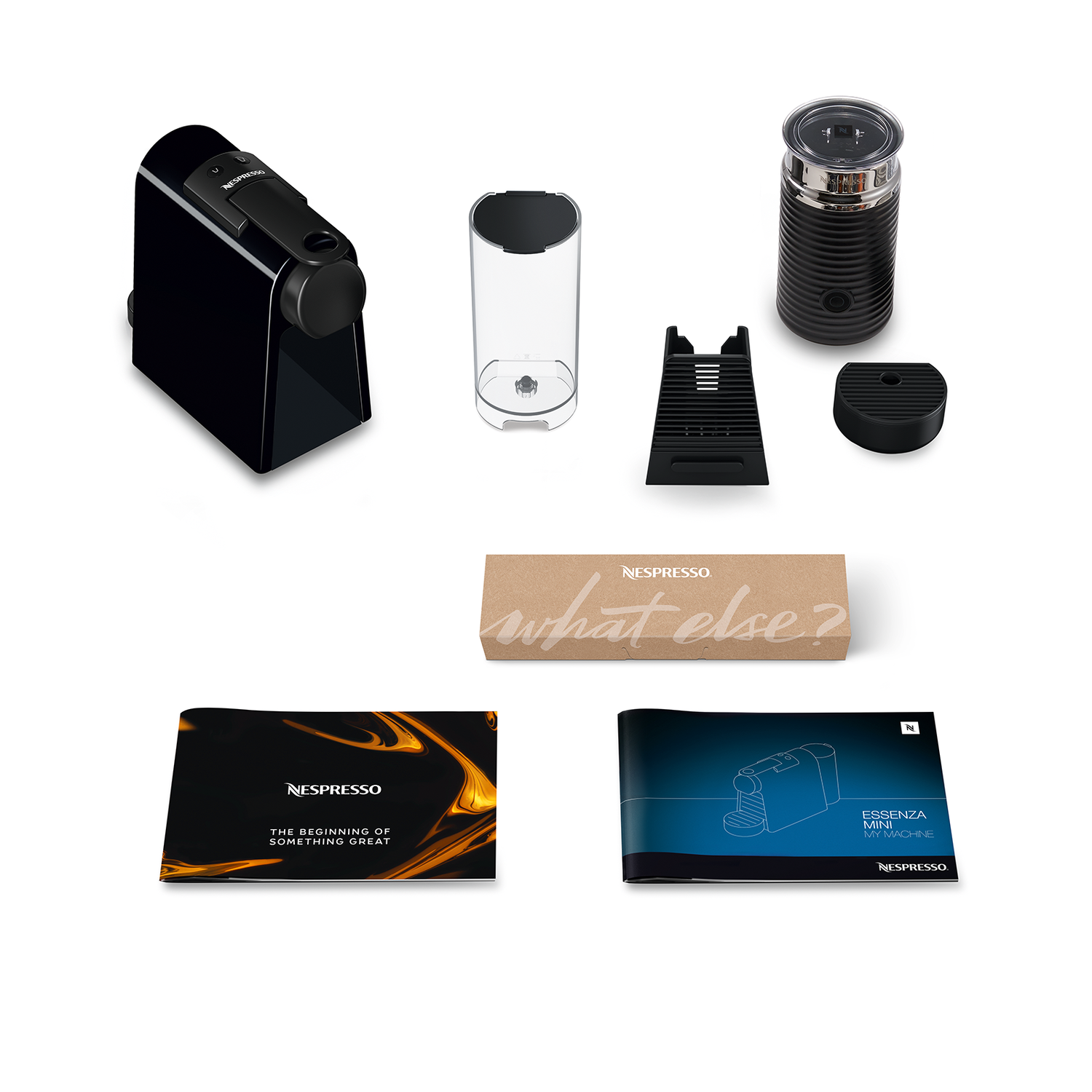 Black coffee machine and accessories laid out on white, including a box and manuals.