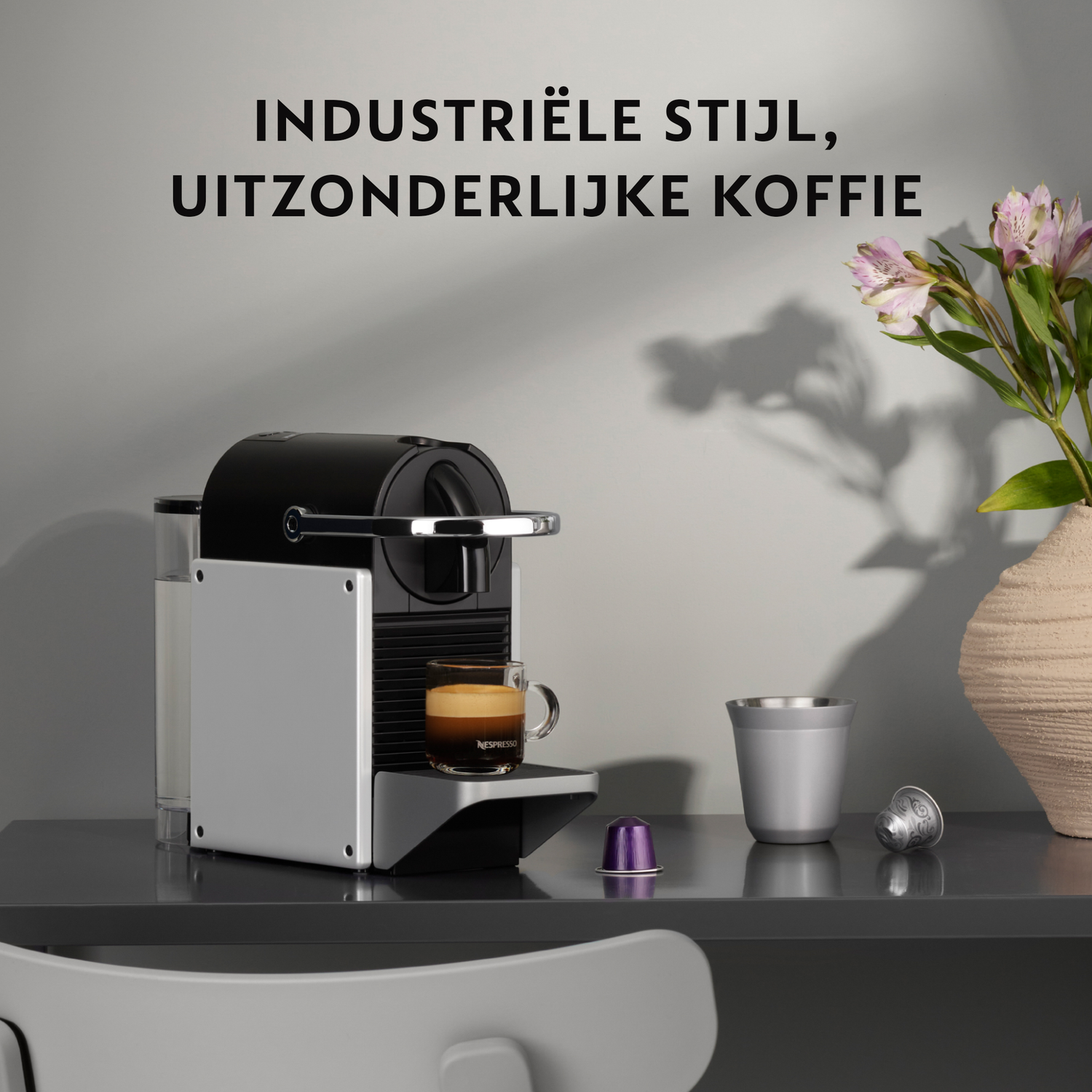 Nespresso machine with a cup of coffee.