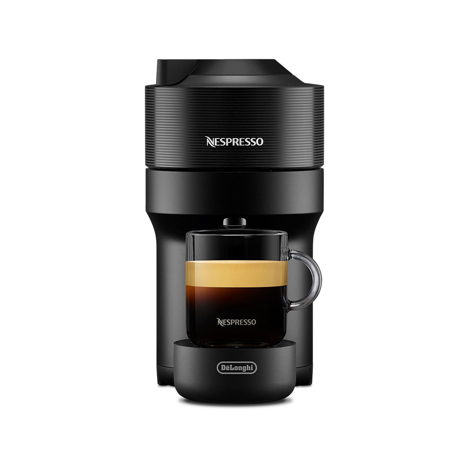A black Nespresso coffee machine with a glass cup holding coffee. The cup sits on a base.
