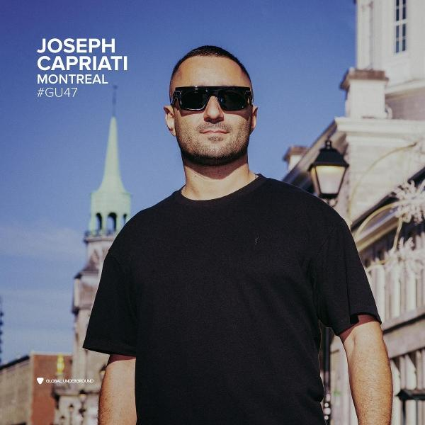 Man met zonnebril voor gebouwen. Tekst: 'JOSEPH CAPRIATI MONTREAL #GU47'.