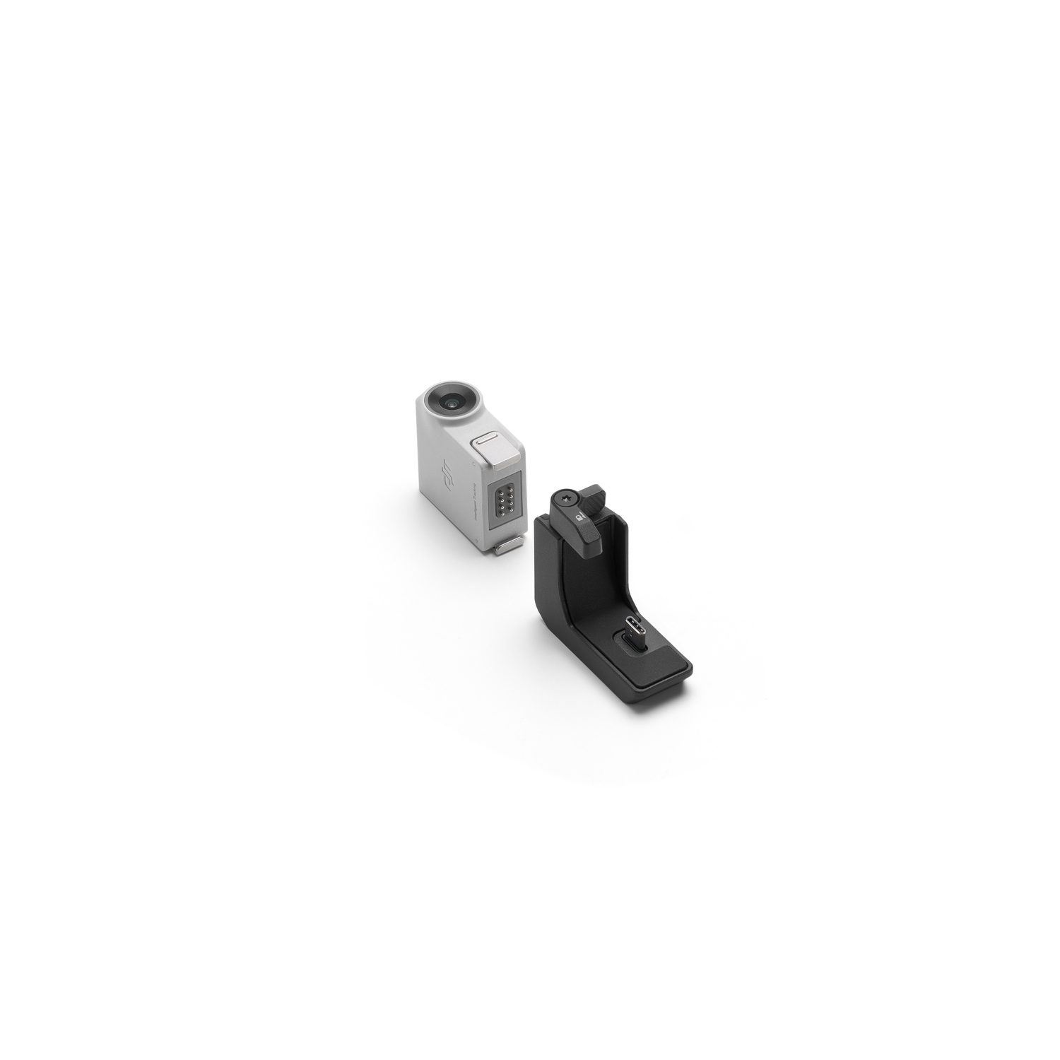 A silver action camera and black mounting accessory.