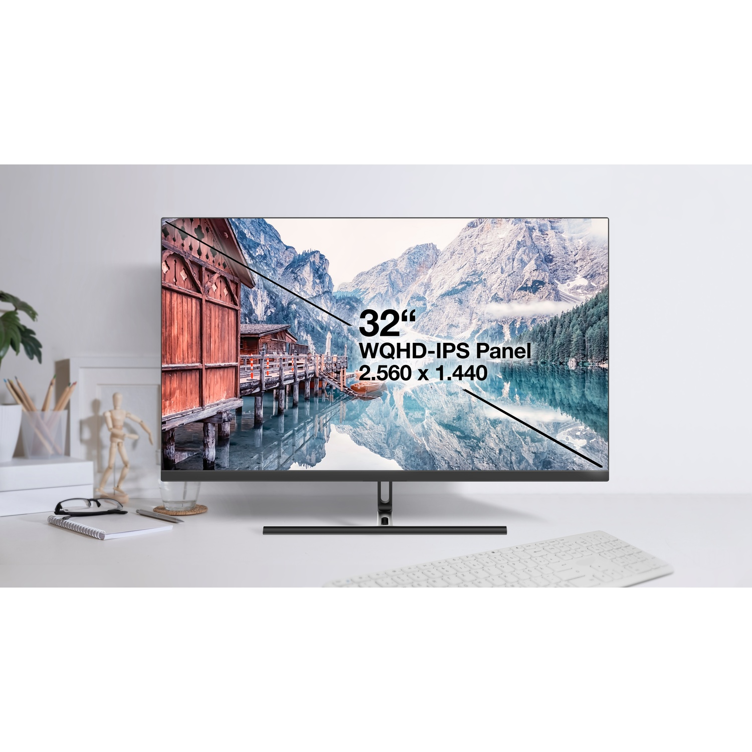 Un monitor da 32" che mostra un'immagine di paesaggio con sovrapposizione di testo.