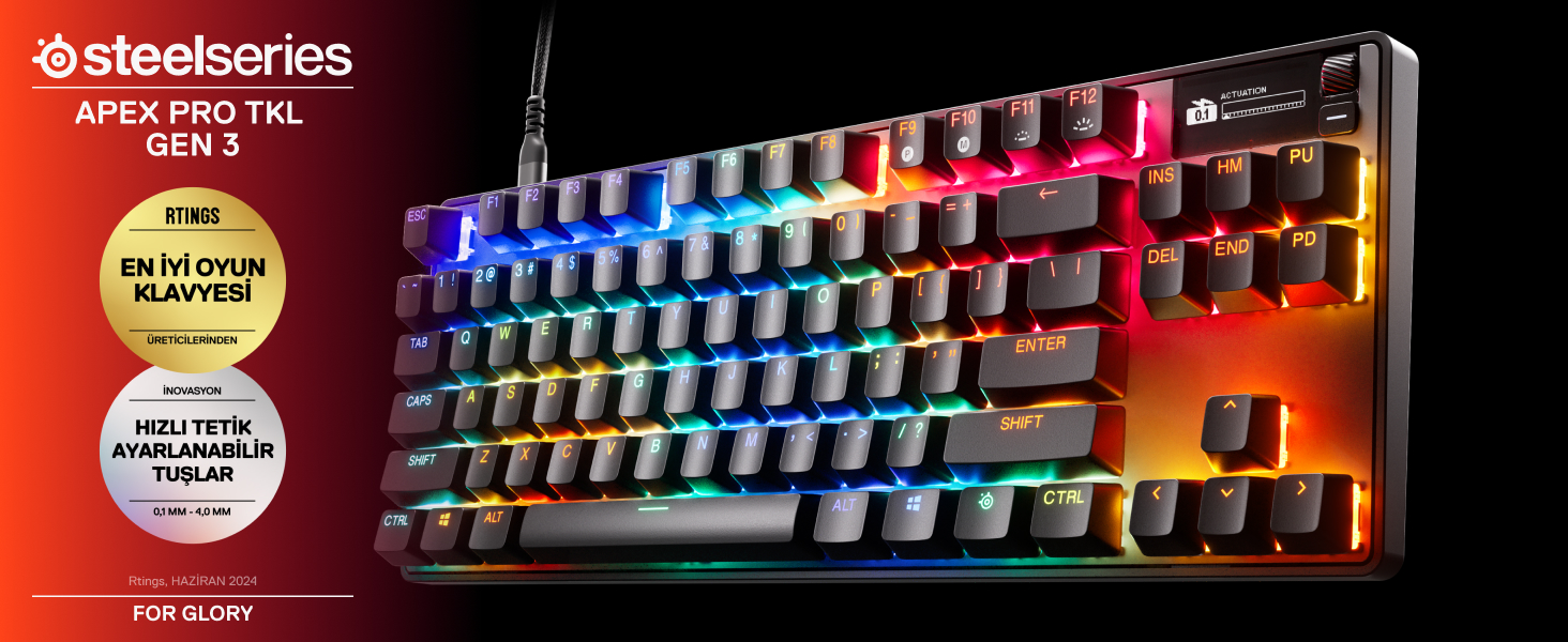Kırmızı ve siyah bir afiş ile siyah ve renkli Steelseries klavye.