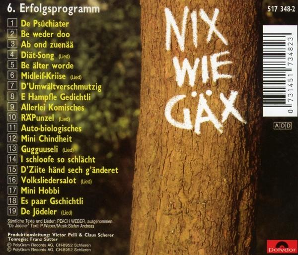 Rückseite einer CD mit Baumstamm und handschriftlichem Text in Weiß.