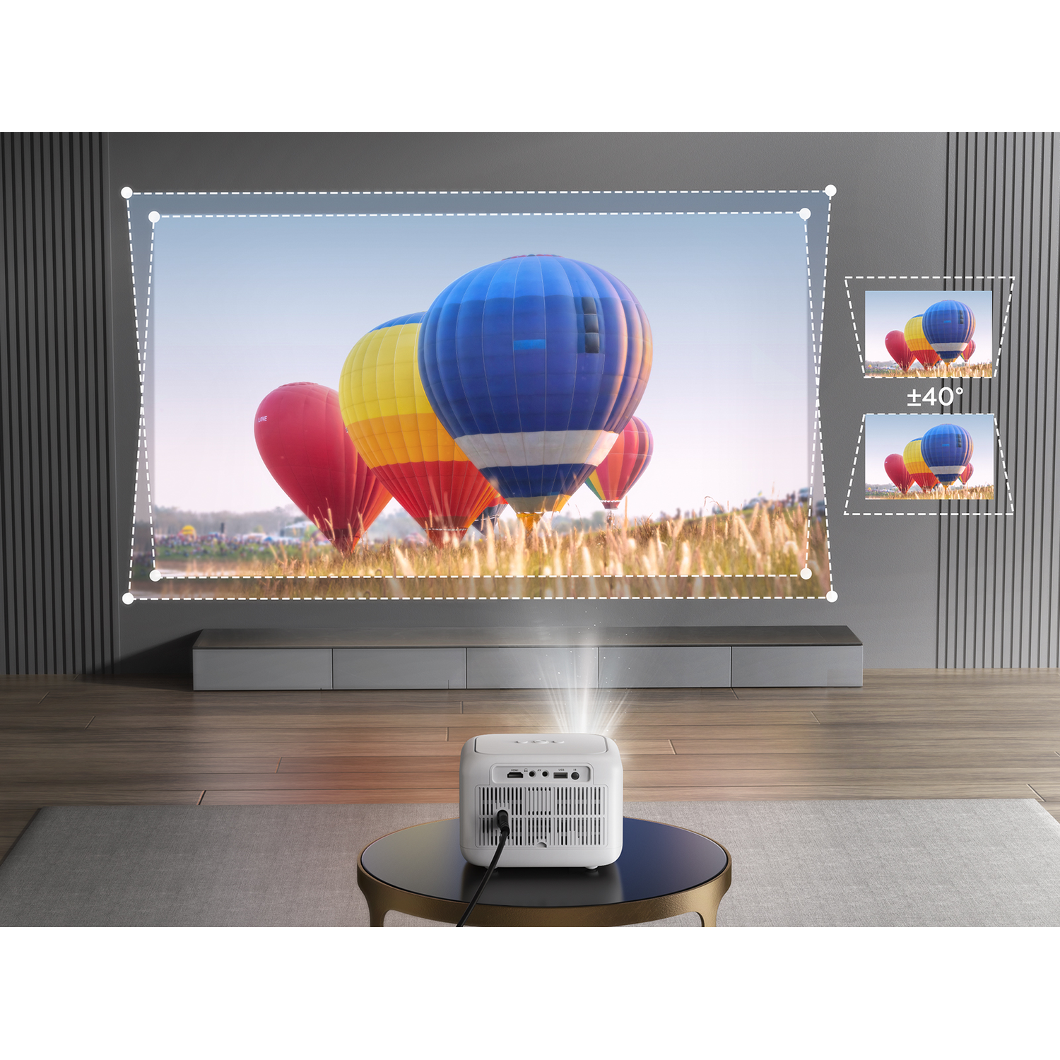 White projector projecting images of hot air balloons on a screen.