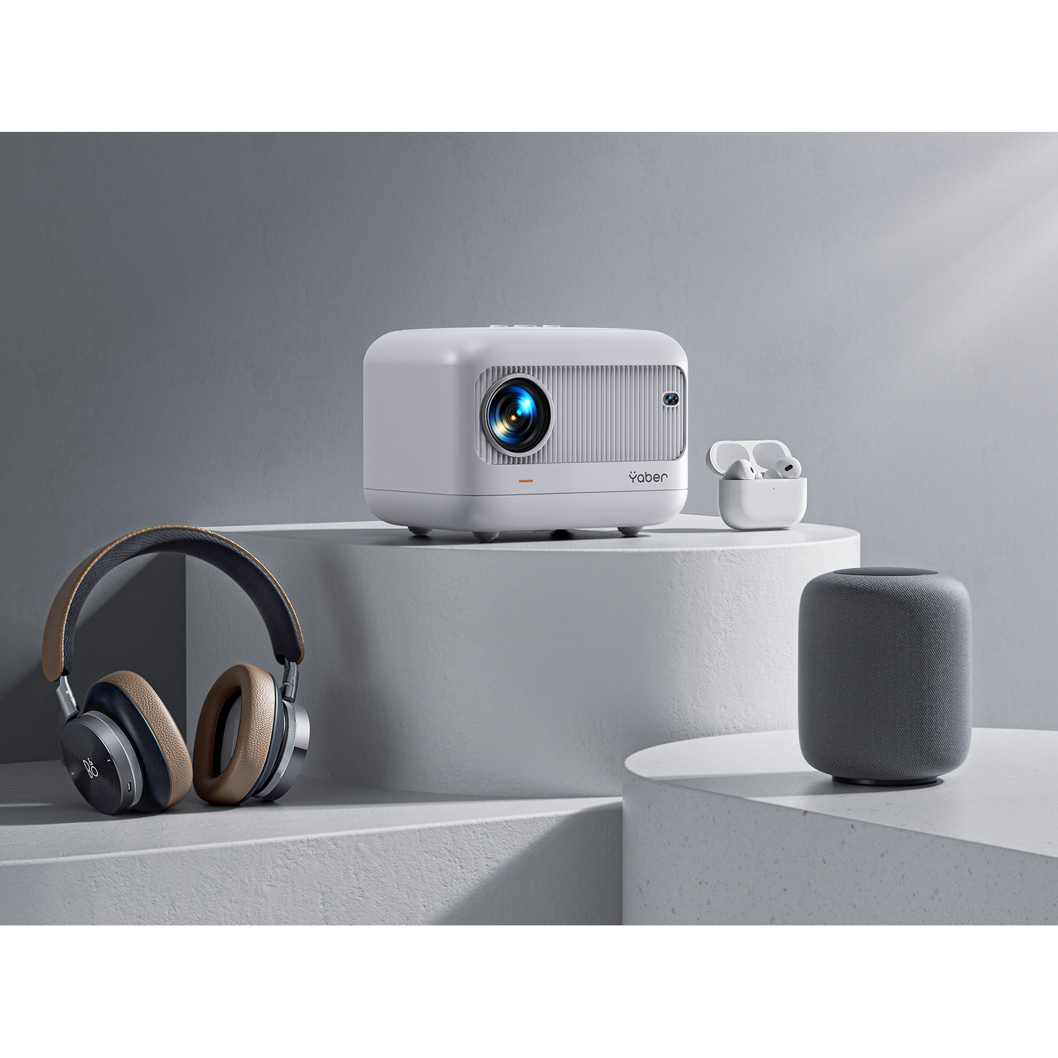 White projector and headphones with speaker and earbuds. White background.