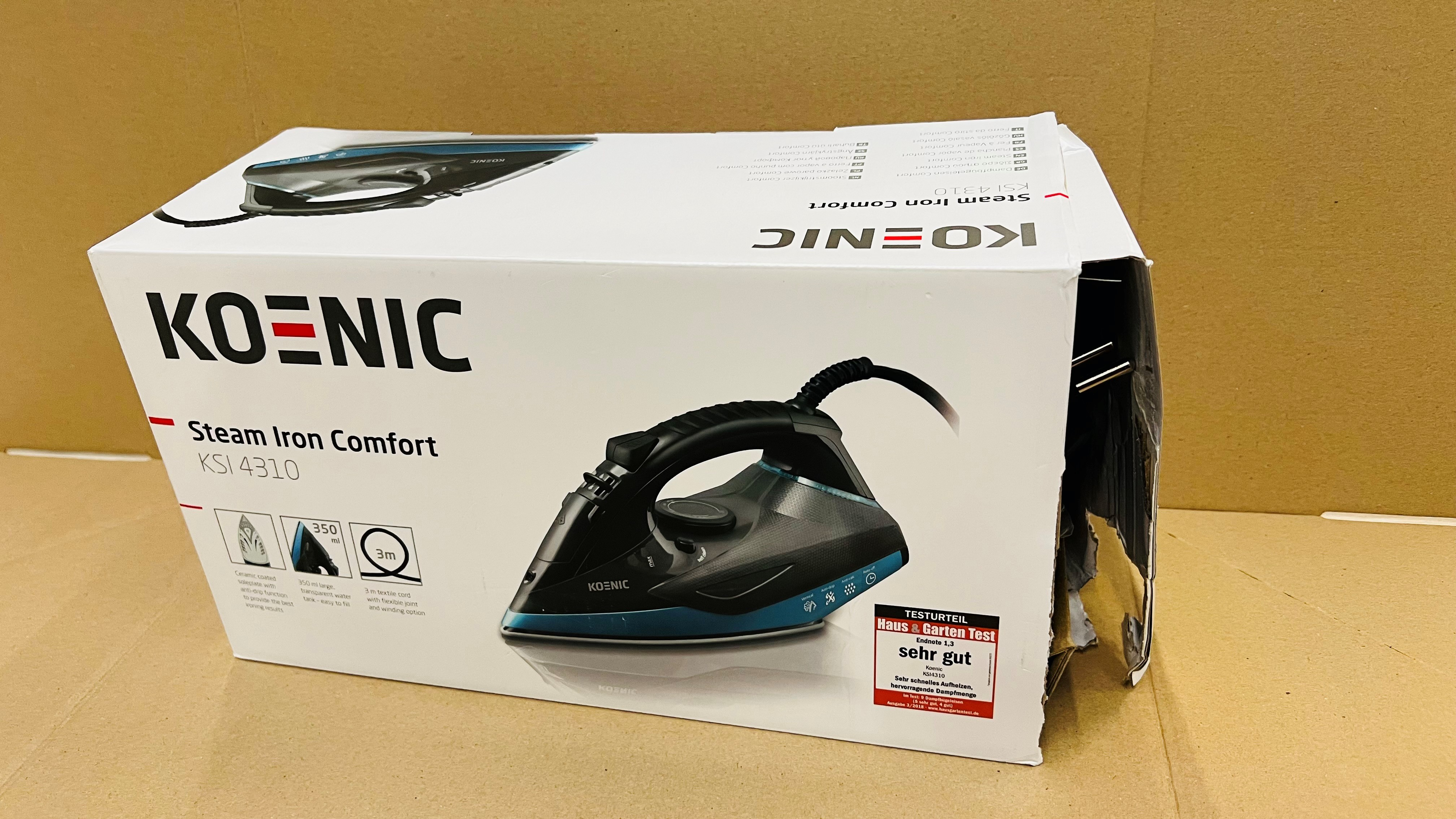 Zapakowane żelazko parowe, czarno-turkusowe, stojące na powierzchni.