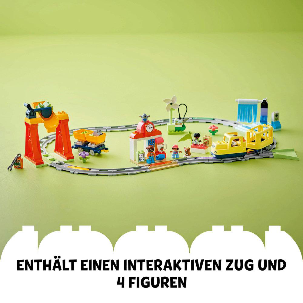 Ein farbenfrohes Spielzeugzug-Set mit Gleis, Bahnhof und Figuren.