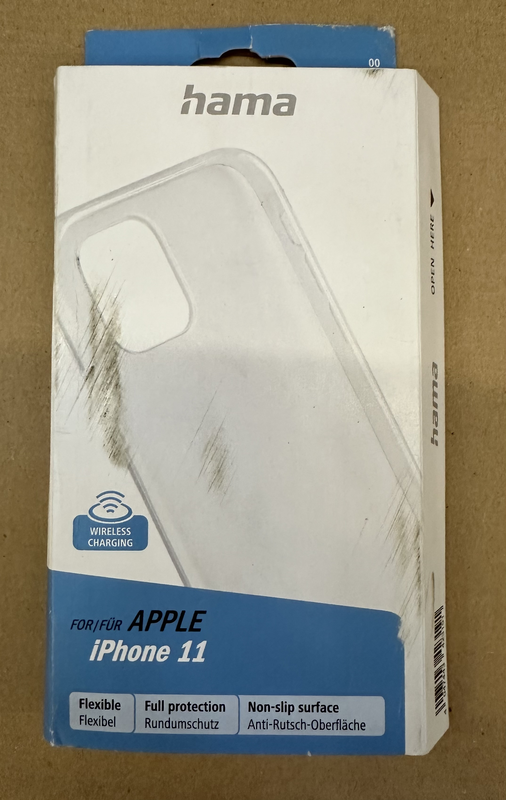 Etui na iPhone 11 w białym pudełku. Pudełko ma logo Hama i tekst o ładowaniu bezprzewodowym.