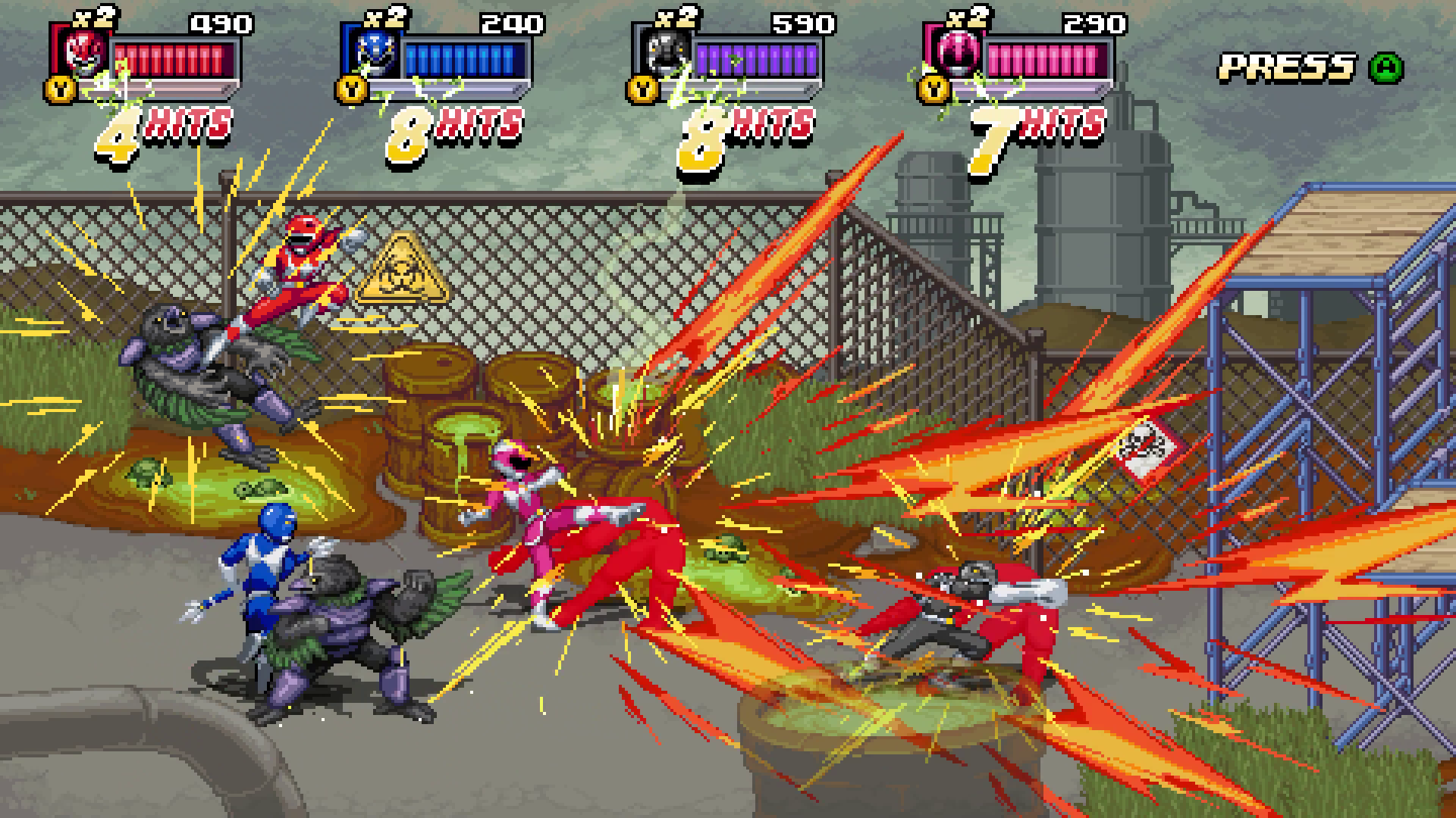 Imagen pixelada de un juego de lucha. Power Rangers luchan contra monstruos.