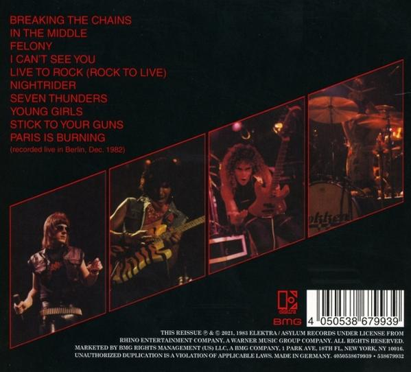 Albumcover mit Bandfoto und Songtiteln, darunter 'Breaking the Chains' und 'Paris is Burning'.