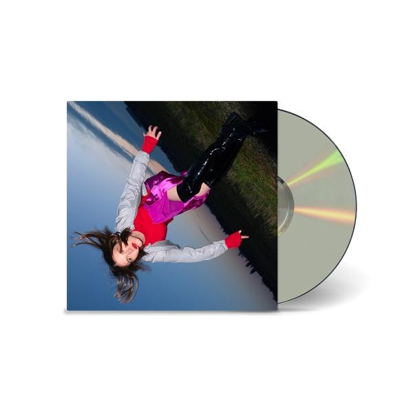 CD-Cover mit einer Frau, die kopfüber fällt, mit blauem und hellem Himmel im Hintergrund und eine CD.