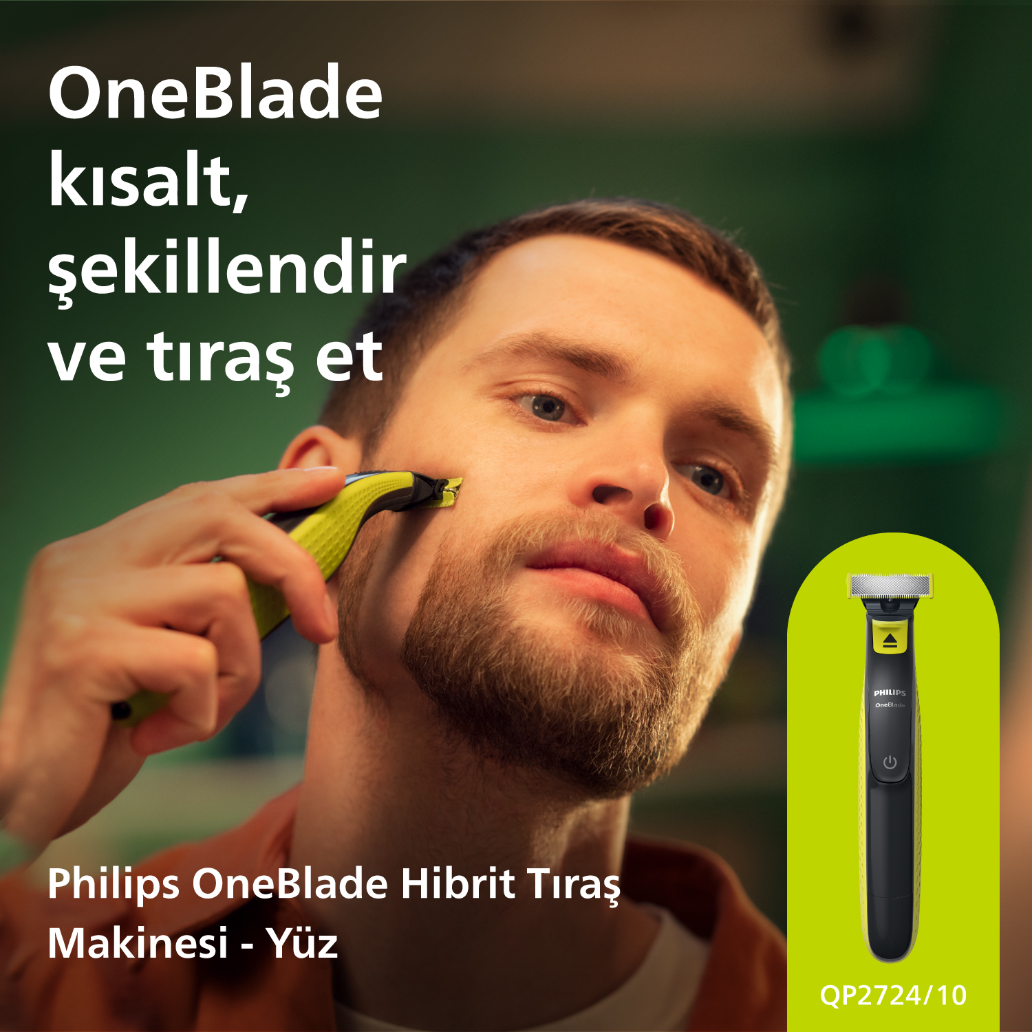 Yeşil ve siyah bir Philips OneBlade düzeltici ile tıraş olan adam.