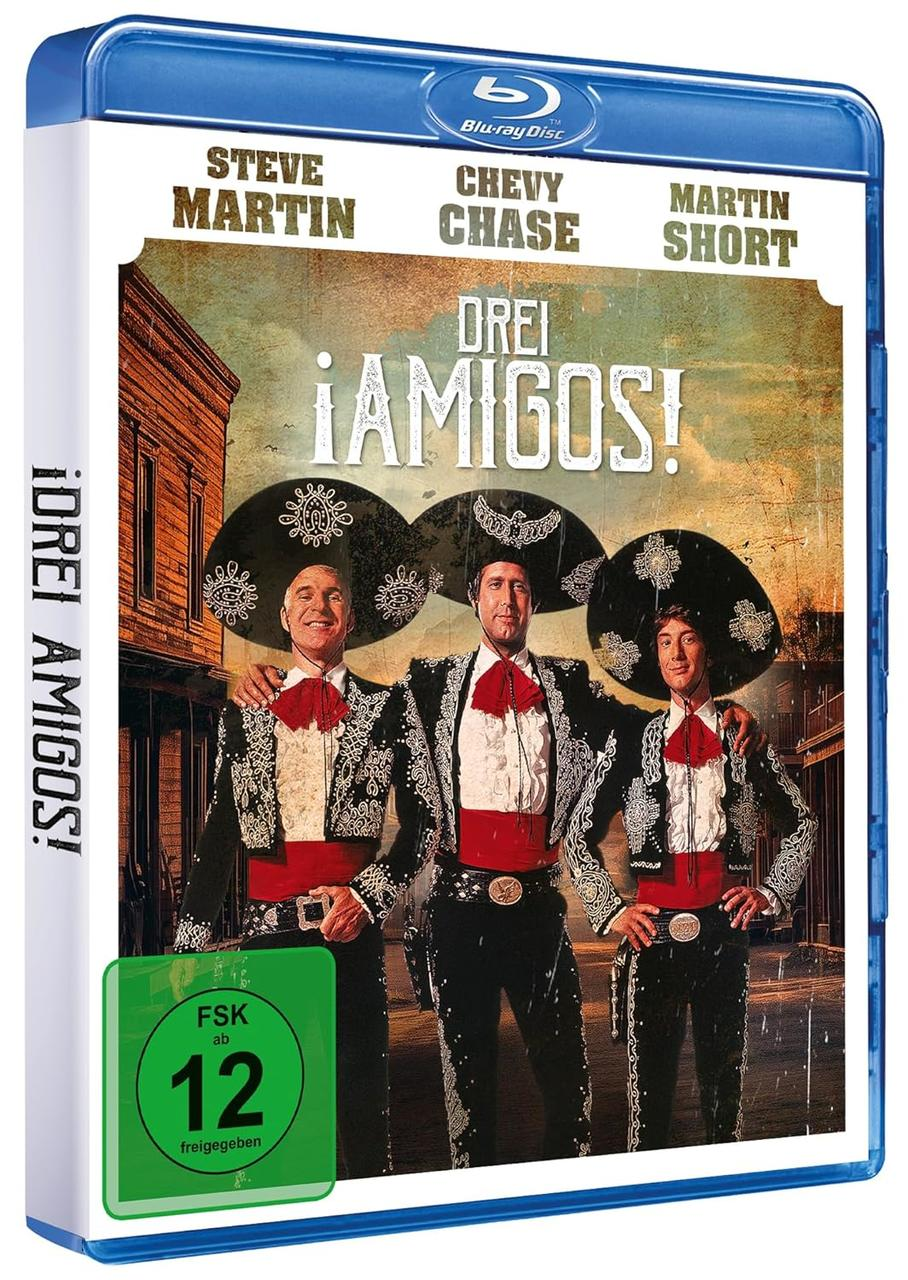 Filmcover: Drei Männer in Mariachi-Anzügen. Titel: !Drei Amigos! Grüne und weiße Box.