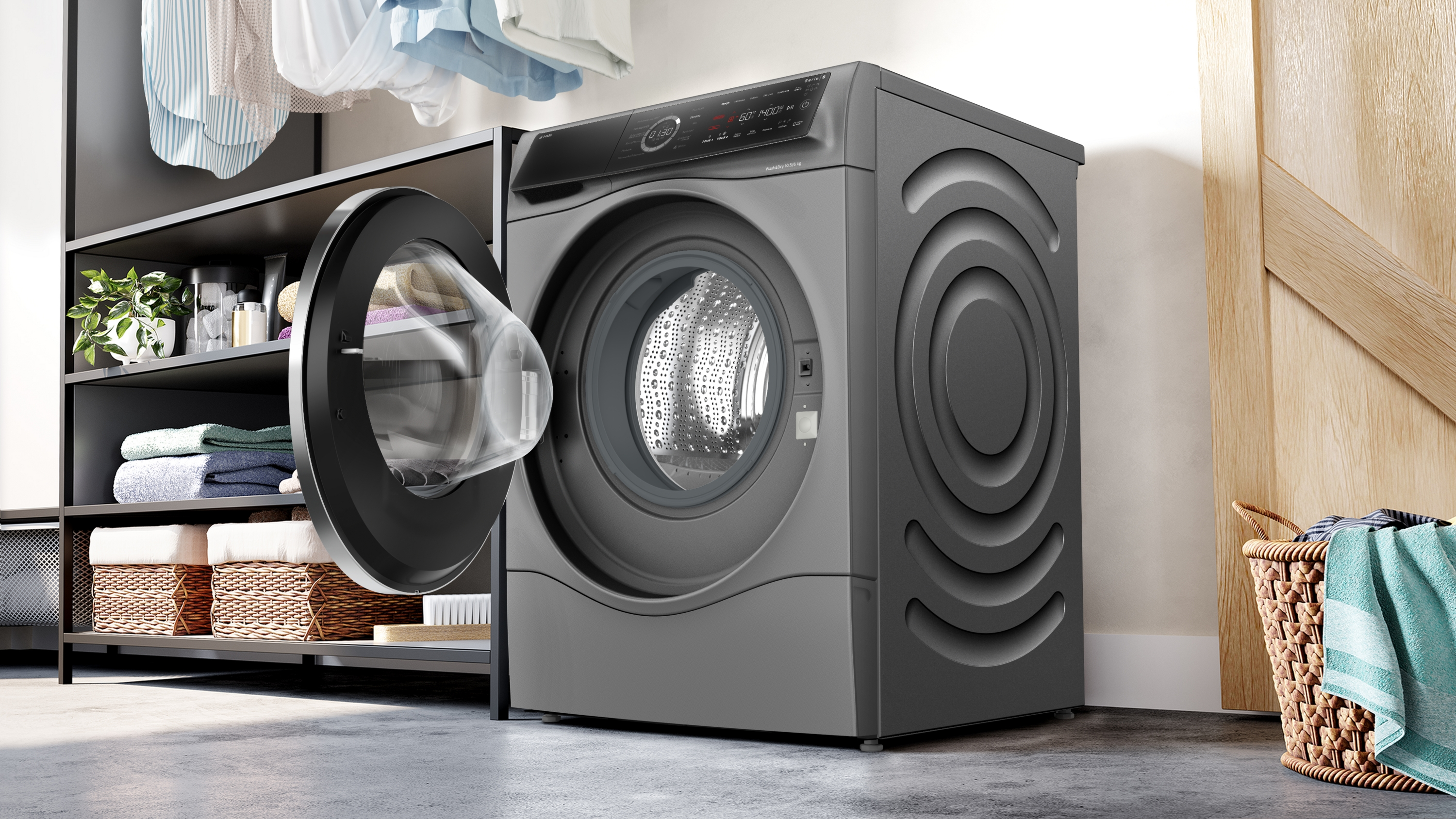 Szara pralka z otwartymi drzwiami, w pralni z półkami i koszem.
